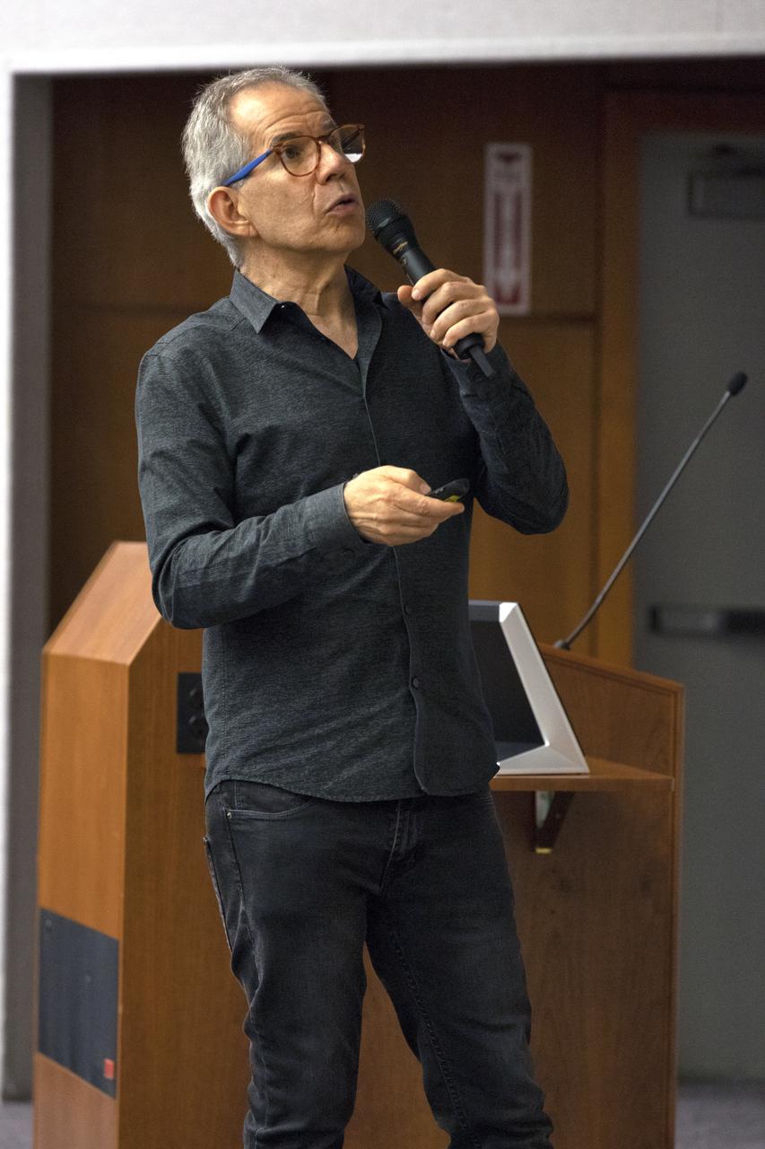 Dr. Humberto Campins from the University of Central Florida speaks to Kennedy Space Center employees in the Florida spaceport’s Neil Armstrong O&C Mission Briefing Room on April 16, 2019, to give a status update on NASA’s Origins, Spectral Interpretation, Resource Identification, Security-Regolith Explorer (OSIRIS-REx). The first U.S. mission to sample an asteroid, OSIRIS-REx launched from Cape Canaveral Air Force Station on Sept. 8, 2016 aboard a United Launch Alliance Atlas V rocket. Management of the launch service for OSIRIS-REx was the responsibility of NASA’s Launch Services Program, based at Kennedy.