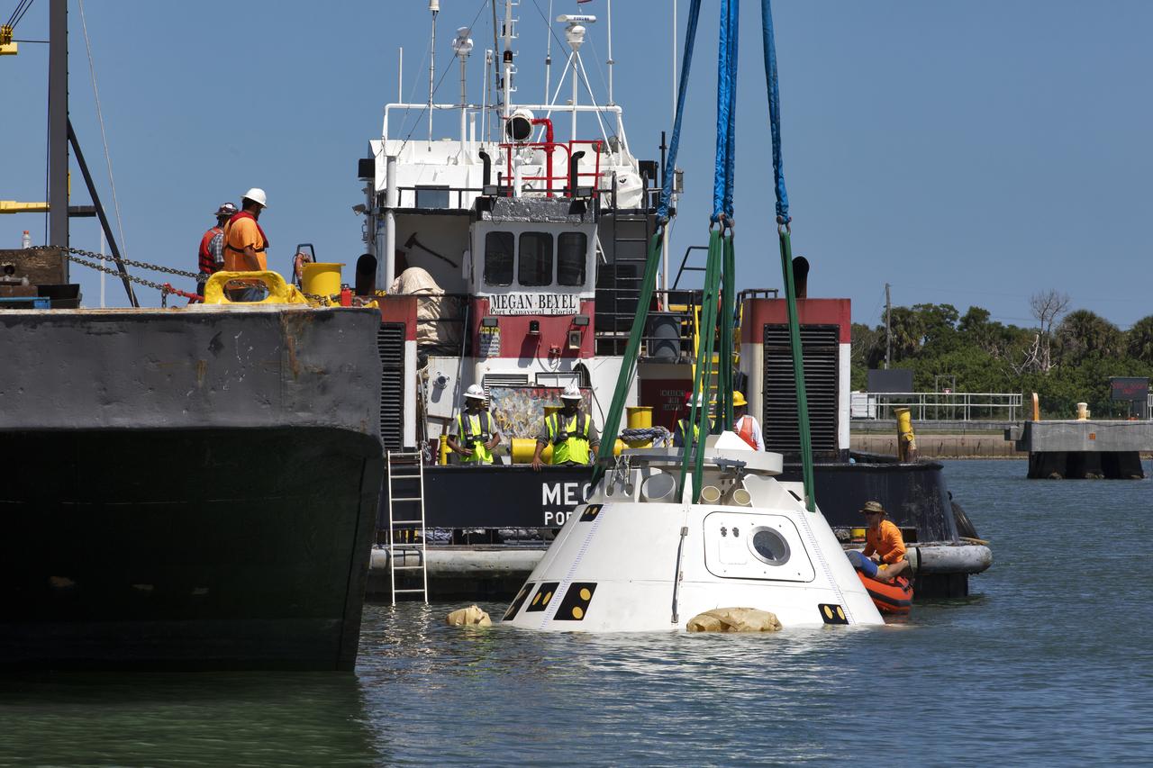The Boeing CST-100 Starliner training capsule, known as Boiler Plate 3, is lowered into the water at the Army Wharf at Cape Canaveral Air Force Station in Florida on April 16, 2019. NASA and the Department of Defense Human Space Flight Support Office Rescue Division are conducting a search and rescue training exercise over the next several days at the Wharf and in the Atlantic Ocean simulating a rescue in the unlikely event of an emergency. It is the first at-sea exercise with the Starliner training capsule ahead of Boeing’s Crew Flight Test with astronauts targeted for later this year. During normal return scenarios, Boeing's Starliner will land on land in a safe zone of about 15 square miles in the Western United States. Throughout the commercial crew development phases with NASA, Boeing has performed dozens of qualification tests on its parachute and airbag systems simulating conditions on land and in the water.