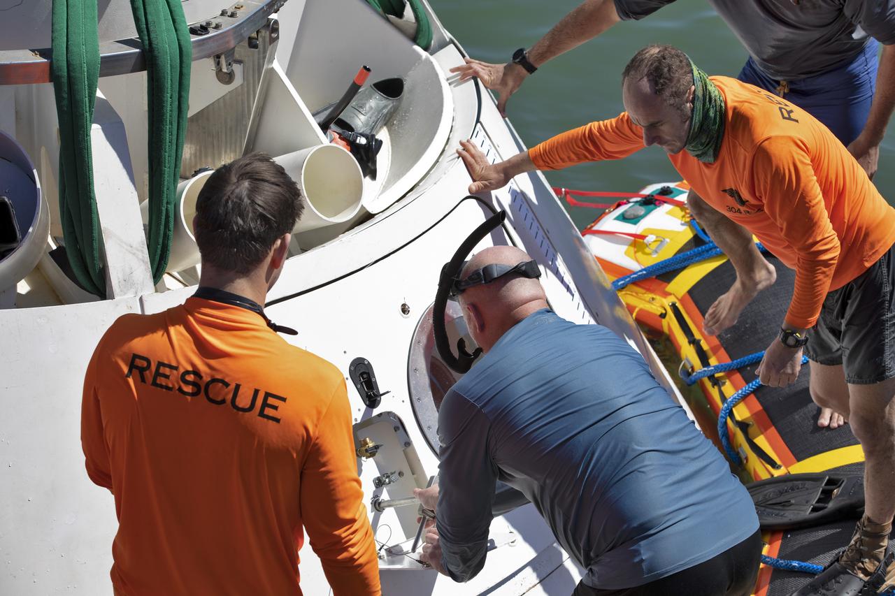 Rescue team members perform checks of the Boeing CST-100 Starliner training capsule, known as Boiler Plate 3, during a search and rescue exercise on April 16, 2019. NASA and the Department of Defense Human Space Flight Support Office Rescue Division are conducting a search and rescue training exercise over the next several days at the Wharf and in the Atlantic Ocean simulating a rescue in the unlikely event of an emergency. It is the first at-sea exercise with the Starliner training capsule ahead of Boeing’s Crew Flight Test with astronauts targeted for later this year. During normal return scenarios, Boeing's Starliner will land on land in a safe zone of about 15 square miles in the Western United States. Throughout the commercial crew development phases with NASA, Boeing has performed dozens of qualification tests on its parachute and airbag systems simulating conditions on land and in the water.