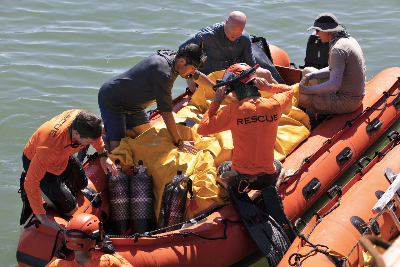 Rescue team members prepare an inflatable front porch that will be attached to the Boeing CST-100 Starliner training capsule, known as Boiler Plate 3, during a search and rescue training exercise at the Army Wharf at Cape Canaveral Air Force Station in Florida on April 16, 2019. The front porch will be used to extract astronauts from the capsule and conduct initial health assessments in the unlikely event of an emergency resulting in a splashdown. NASA and the Department of Defense Human Space Flight Support Office Rescue Division are conducting the exercise over the next several days at the Wharf and in the Atlantic Ocean. It is the first at-sea exercise with the Starliner training capsule ahead of Boeing’s Crew Flight Test with astronauts targeted for later this year. During normal return scenarios, Boeing's Starliner will land on land in a safe zone of about 15 square miles in the Western United States. Throughout the commercial crew development phases with NASA, Boeing has performed dozens of qualification tests on its parachute and airbag systems simulating conditions on land and in the water.