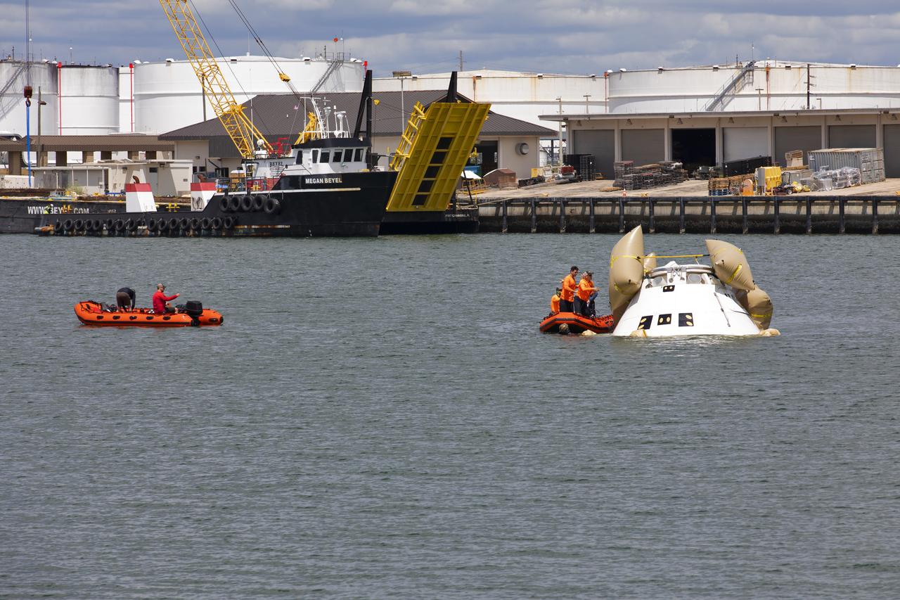 Rescue team members are using a Boeing CST-100 Starliner training capsule, known as Boiler Plate 3, to practice uprighting procedures in the unlikely event of an emergency resulting in a splashdown. NASA and the Department of Defense Human Space Flight Support Office Rescue Division conducted a search and rescue training exercise at the Army Wharf at Cape Canaveral Air Force Station in Florida on April 17, 2019. The manual uprighting airbags could be used to lift the spacecraft to its upright position. This is the first at-sea exercise with the Starliner training capsule ahead of Boeing’s Crew Flight Test with astronauts targeted for later this year. During normal return scenarios, Boeing's Starliner will land on land in a safe zone of about 15 square miles in the Western United States. Throughout the commercial crew development phases with NASA, Boeing has performed dozens of qualification tests on its parachute and airbag systems simulating conditions on land and in the water.