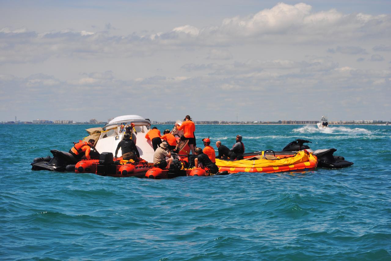 Rescue team members are using a Boeing CST-100 Starliner training capsule to rehearse a search and rescue training exercise in the unlikely event of an emergency resulting in a splashdown. NASA and the Department of Defense (DoD) Human Space Flight Support Office Rescue Division conducted the open-ocean exercise, after nearly two weeks of training, off the coast of Cape Canaveral near the agency’s Kennedy Space Center in Florida on April 25, 2019. This exercise provides team members with the necessary training ahead of Boeing’s Crew Flight Test with astronauts targeted for later this year. During normal return scenarios, Boeing’s Starliner will land in a safe zone of about 15 square miles in the Western United States. Throughout the commercial crew development phases with NASA, Boeing has performed dozens of qualification tests on its parachute and airbag systems simulating conditions on land and in the water.
