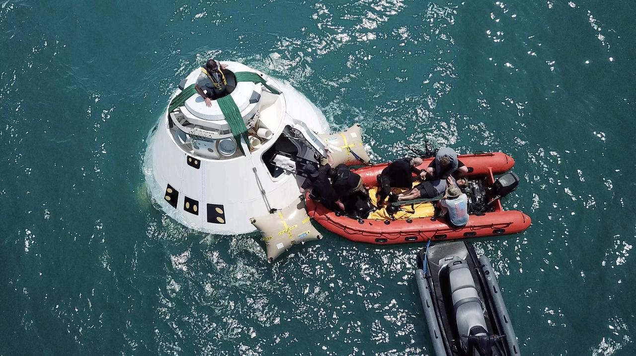 Rescue team members are using a Boeing CST-100 Starliner training capsule to rehearse a search and rescue training exercise in the unlikely event of an emergency resulting in a splashdown. NASA and the Department of Defense (DoD) Human Space Flight Support Office Rescue Division conducted the open-ocean exercise, after nearly two weeks of training, off the coast of Cape Canaveral near the agency’s Kennedy Space Center in Florida on April 25, 2019. This exercise provides team members with the necessary training ahead of Boeing’s Crew Flight Test with astronauts targeted for later this year. During normal return scenarios, Boeing’s Starliner will land in a safe zone of about 15 square miles in the Western United States. Throughout the commercial crew development phases with NASA, Boeing has performed dozens of qualification tests on its parachute and airbag systems simulating conditions on land and in the water. 