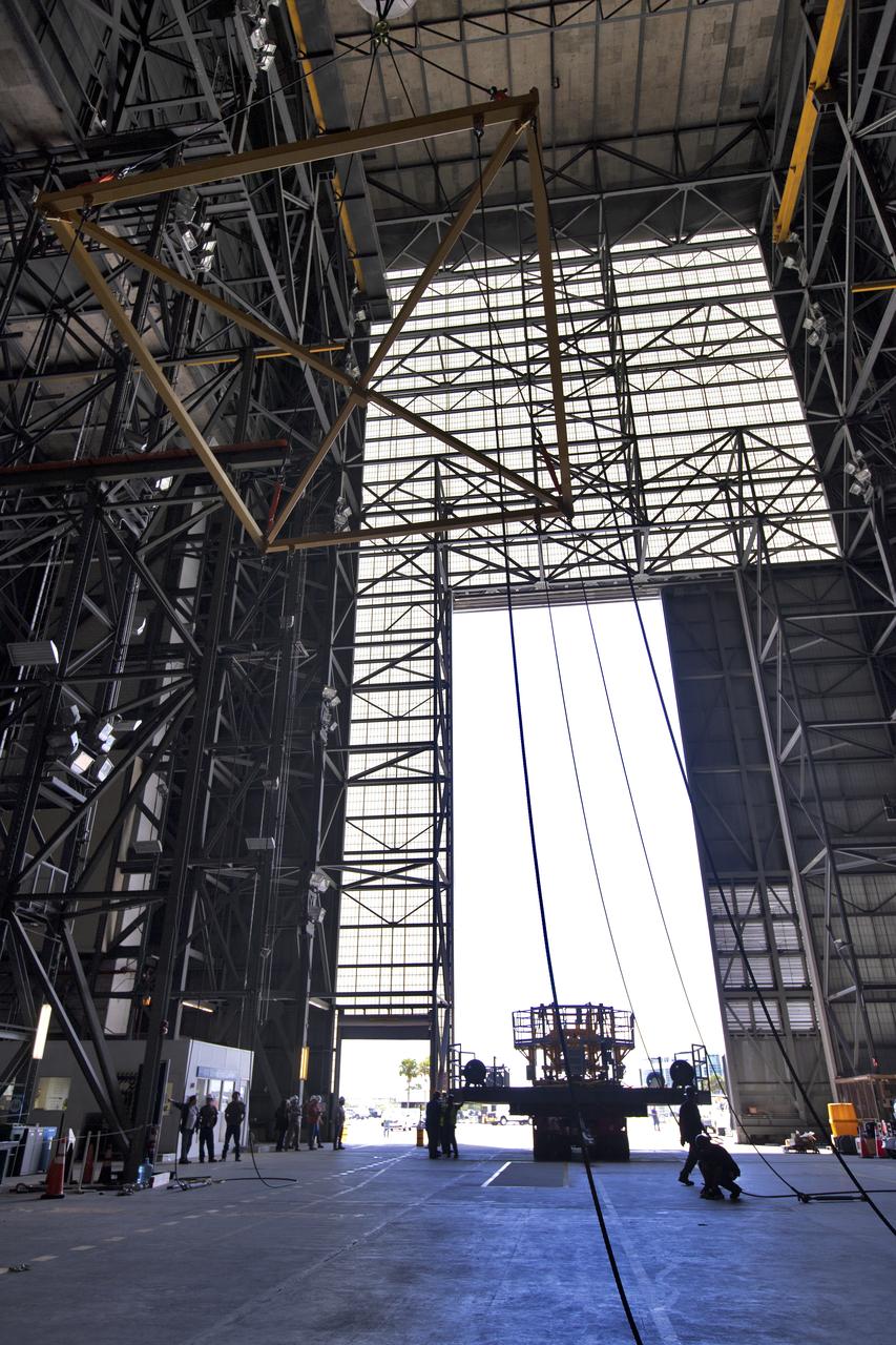 The engine vertical installer for NASA’s Space Launch System (SLS) arrives inside the Vehicle Assembly at NASA’s Kennedy Space Center in Florida on April 25, 2019. The engine installer arrived from the manufacturer, Precision Fabrication and Cleaning in Canaveral Groves, Florida. The new ground support equipment will be ready for preflight processing in the event one of the four RS-25 engines on the core stage of the SLS rocket needs to be replaced. During launch of the SLS and Orion spacecraft, the four core stage engines will provide the thrust needed to lift the rocket and Orion spacecraft off Launch Pad 39B at Kennedy for Exploration Mission-1. The uncrewed Orion will travel on a three-week test mission thousands of miles beyond the Moon and back to Earth for a splashdown in the Pacific Ocean.