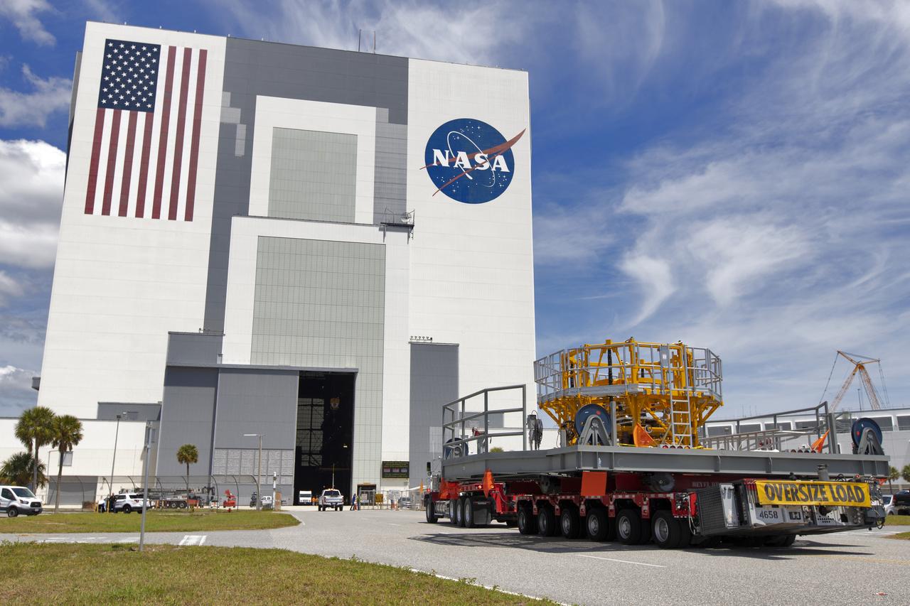 The engine vertical installer for NASA’s Space Launch System (SLS) arrives at the Vehicle Assembly at NASA’s Kennedy Space Center in Florida on April 25, 2019. The engine installer arrived from the manufacturer, Precision Fabrication and Cleaning in Canaveral Groves, Florida. The new ground support equipment will be ready for preflight processing in the event one of the four RS-25 engines on the core stage of the SLS rocket needs to be replaced. During launch of the SLS and Orion spacecraft, the four core stage engines will provide the thrust needed to lift the rocket and Orion spacecraft off Launch Pad 39B at Kennedy for Exploration Mission-1. The uncrewed Orion will travel on a three-week test mission thousands of miles beyond the Moon and back to Earth for a splashdown in the Pacific Ocean.