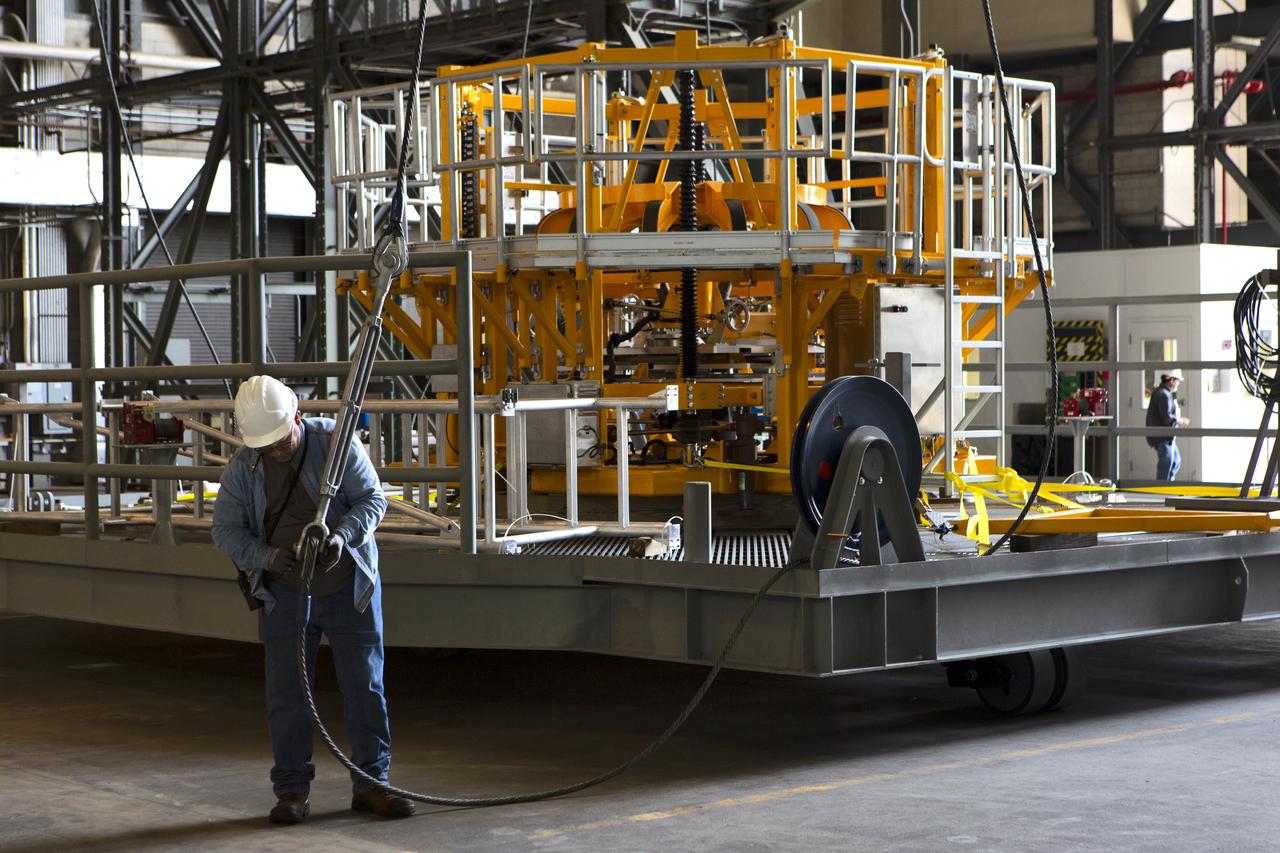 The engine vertical installer for NASA’s Space Launch System (SLS) is inside the Vehicle Assembly at NASA’s Kennedy Space Center in Florida on April 25, 2019. Preparations are underway to lift the engine installer up and into High Bay 3. The engine installer arrived from the manufacturer, Precision Fabrication and Cleaning in Canaveral Groves, Florida. The new ground support equipment will be ready for preflight processing in the event one of the four RS-25 engines on the core stage of the SLS rocket needs to be replaced. During launch of the SLS and Orion spacecraft, the four core stage engines will provide the thrust needed to lift the rocket and Orion spacecraft off Launch Pad 39B at Kennedy for Exploration Mission-1. The uncrewed Orion will travel on a three-week test mission thousands of miles beyond the Moon and back to Earth for a splashdown in the Pacific Ocean.