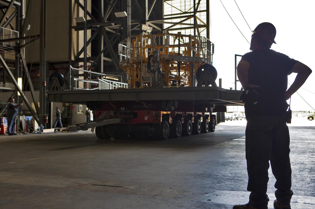 The engine vertical installer for NASA’s Space Launch System (SLS) is inside the Vehicle Assembly at NASA’s Kennedy Space Center in Florida on April 25, 2019. The engine installer will be lifted up by crane for transfer to High Bay 3. The engine installer arrived from the manufacturer, Precision Fabrication and Cleaning in Canaveral Groves, Florida. The new ground support equipment will be ready for preflight processing in the event one of the four RS-25 engines on the core stage of the SLS rocket needs to be replaced. During launch of the SLS and Orion spacecraft, the four core stage engines will provide the thrust needed to lift the rocket and Orion spacecraft off Launch Pad 39B at Kennedy for Exploration Mission-1. The uncrewed Orion will travel on a three-week test mission thousands of miles beyond the Moon and back to Earth for a splashdown in the Pacific Ocean.