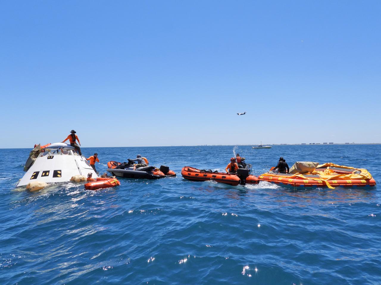 Rescue team members are using a Boeing CST-100 Starliner training capsule to rehearse a full mission profile training exercise in the unlikely event of an emergency resulting in a splashdown. NASA and the Department of Defense (DoD) Human Space Flight Support Office Rescue Division conducted the exercise, after a culmination of nearly two weeks of training, off the coast of Cape Canaveral near the agency’s Kennedy Space Center in Florida on April 27, 2019. The team rehearsed assisted egress, extracting DoD team members acting as astronauts, from the capsule and providing immediate medical treatment. This open-ocean exercise provides team members with the necessary training ahead of Boeing’s Crew Flight Test with astronauts targeted for later this year. During normal return scenarios, Boeing’s Starliner will land in a safe zone of about 15 square miles in the Western United States. Throughout the commercial crew development phases with NASA, Boeing has performed dozens of qualification tests on its parachute and airbag systems simulating conditions on land and in the water. 