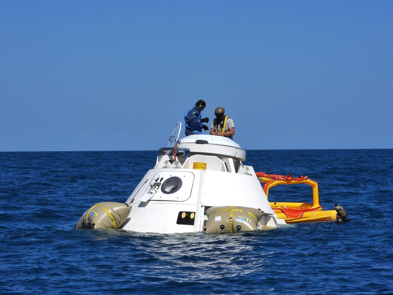 NASA astronauts Suni Williams and Barry “Butch” Wilmore rehearse the steps they would take to exit Boeing’s CST-100 Starliner spacecraft without assistance in the unlikely event of an emergency resulting in a splashdown. The training exercise, which occurred April 27, 2019, took place several miles off the coast of Cape Canaveral near NASA’s Kennedy Space Center in Florida. It included the astronauts unloading a rescue raft from inside the spacecraft, climbing out through a hatch at the top of the spacecraft, jumping into the Atlantic Ocean and boarding the raft. This open-ocean exercise provides the astronauts with the necessary training ahead of Boeing’s Crew Flight Test and subsequent missions. During normal return scenarios, Boeing’s Starliner will land in a safe zone of about 15 square miles in the Western United States. Throughout the commercial crew development phases with NASA, Boeing has performed dozens of qualification tests on its parachute and airbag systems simulating conditions on land and in the water.
