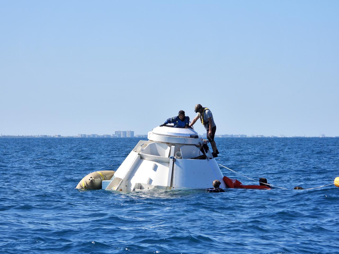 NASA astronauts Suni Williams and Barry “Butch” Wilmore rehearse the steps they would take to exit Boeing’s CST-100 Starliner spacecraft without assistance in the unlikely event of an emergency resulting in a splashdown. The training exercise, which occurred April 27, 2019, took place several miles off the coast of Cape Canaveral near NASA’s Kennedy Space Center in Florida. It included the astronauts unloading a rescue raft from inside the spacecraft, climbing out through a hatch at the top of the spacecraft, jumping into the Atlantic Ocean and boarding the raft. This open-ocean exercise provides the astronauts with the necessary training ahead of Boeing’s Crew Flight Test and subsequent missions. During normal return scenarios, Boeing’s Starliner will land in a safe zone of about 15 square miles in the Western United States. Throughout the commercial crew development phases with NASA, Boeing has performed dozens of qualification tests on its parachute and airbag systems simulating conditions on land and in the water. 