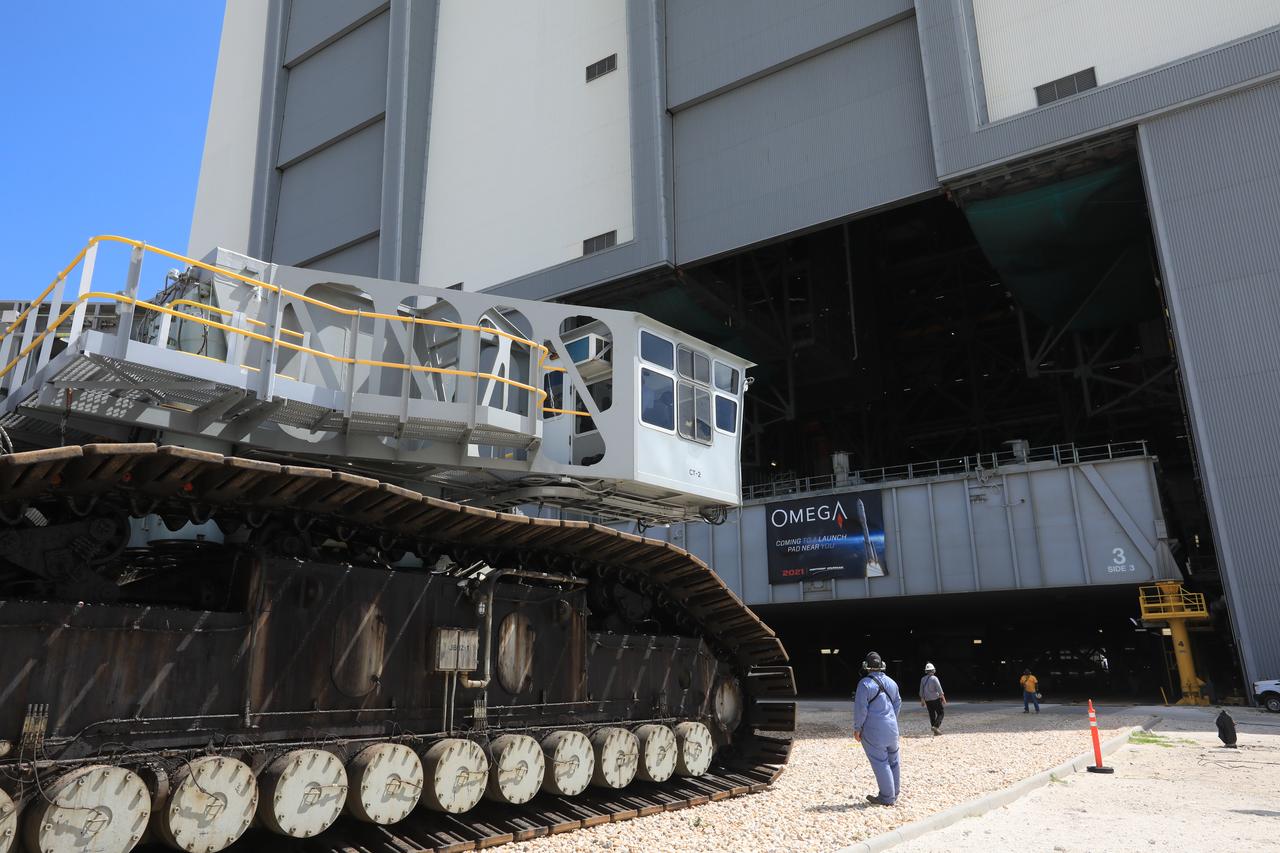 During a practice run, crawler-transporter 2 (CT-2) is being driven to the Vehicle Assembly Building (VAB) at NASA’s Kennedy Space Center in Florida on May 1, 2019. CT-2 entered High Bay 2, and picked up the space shuttle-era mobile launch platform-3 (MLP-3). The VAB is getting its first commercial tenant. Northrop Grumman signed a Reimbursable Space Act Agreement with NASA for use of the facilities. The company will assemble and test its new OmegA rocket inside the massive facility’s High Bay 2. The company also will modify MLP-3 to serve as the launch vehicle’s assembly and launch platform. Northrop Grumman is developing the OmegA rocket, an intermediate/heavy-class launch vehicle, as part of a launch services agreement with the U.S. Air Force.