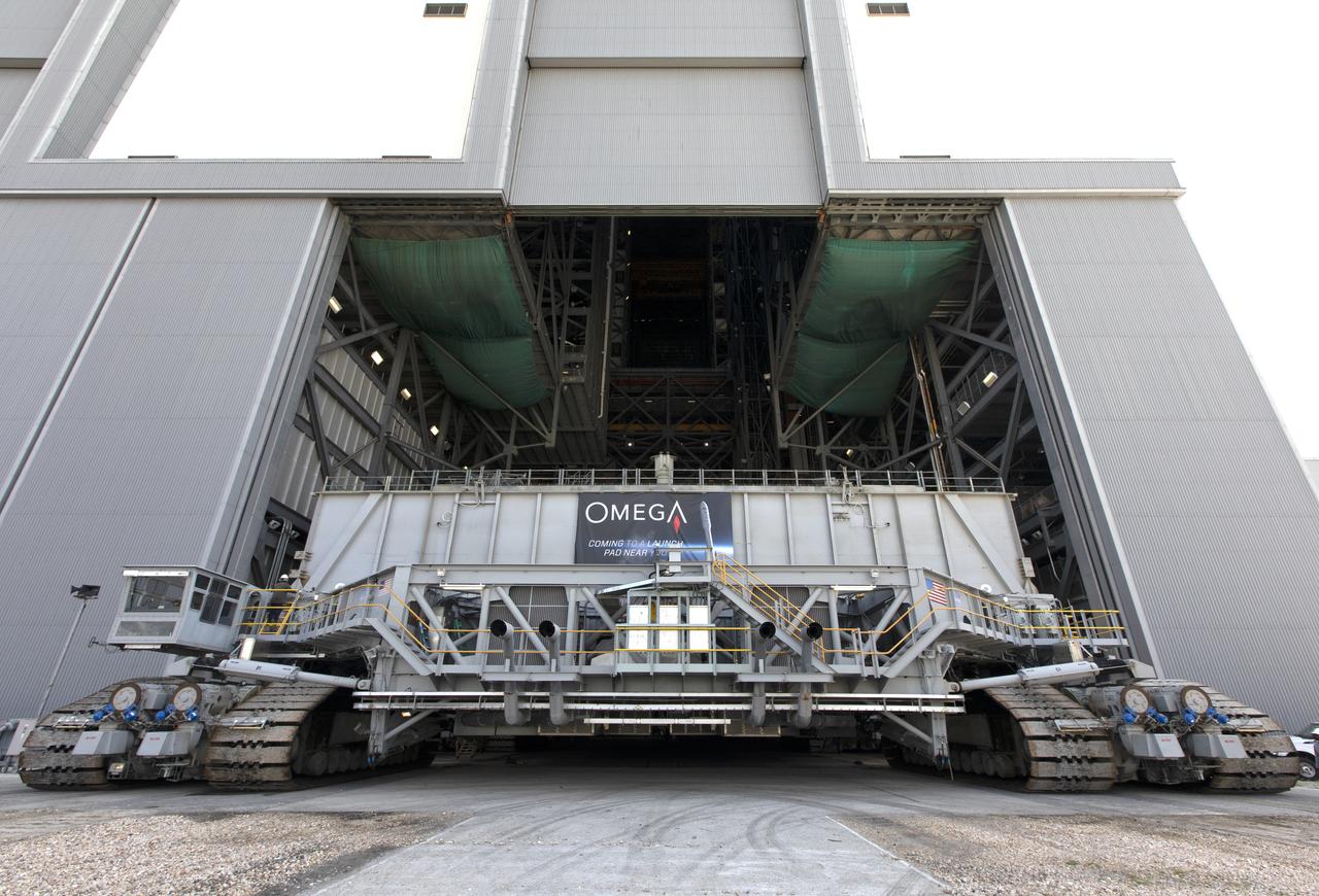 During a practice run, crawler-transporter 2 (CT-2) is moving inside High Bay 2 of the Vehicle Assembly Building (VAB) at NASA’s Kennedy Space Center in Florida on May 1, 2019. CT-2 picked up the space shuttle-era mobile launch platform-3 (MLP-3). The VAB is getting its first commercial tenant. Northrop Grumman signed a Reimbursable Space Act Agreement with NASA for use of the facilities. The company will assemble and test its new OmegA rocket inside the massive facility’s High Bay 2. The company also will modify MLP-3 to serve as the launch vehicle’s assembly and launch platform. Northrop Grumman is developing the OmegA rocket, an intermediate/heavy-class launch vehicle, as part of a launch services agreement with the U.S. Air Force.