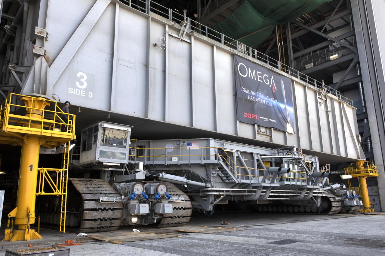 During a practice run, crawler-transporter 2 (CT-2) picked up the space shuttle-era mobile launch platform-3 (MLP-3) inside High Bay 2 of the Vehicle Assembly Building (VAB) at NASA’s Kennedy Space Center in Florida on May 1, 2019. The VAB is getting its first commercial tenant. Northrop Grumman signed a Reimbursable Space Act Agreement with NASA for use of the facilities. The company will assemble and test its new OmegA rocket inside the massive facility’s High Bay 2. The company also will modify MLP-3 to serve as the launch vehicle’s assembly and launch platform. Northrop Grumman is developing the OmegA rocket, an intermediate/heavy-class launch vehicle, as part of a launch services agreement with the U.S. Air Force.