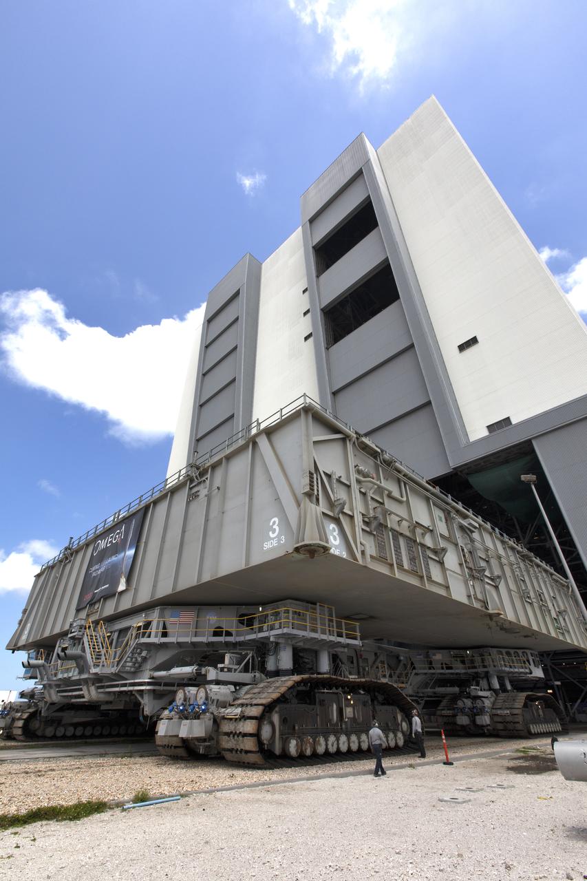 During a practice run, crawler-transporter 2 (CT-2), with the space shuttle-era mobile launch platform-3 (MLP-3) on top, moves out of High Bay 2 of the Vehicle Assembly Building (VAB) at NASA’s Kennedy Space Center in Florida on May 1, 2019. The VAB is getting its first commercial tenant. Northrop Grumman signed a Reimbursable Space Act Agreement with NASA for use of the facilities. The company will assemble and test its new OmegA rocket inside the massive facility’s High Bay 2. The company also will modify MLP-3 to serve as the launch vehicle’s assembly and launch platform. Northrop Grumman is developing the OmegA rocket, an intermediate/heavy-class launch vehicle, as part of a launch services agreement with the U.S. Air Force.