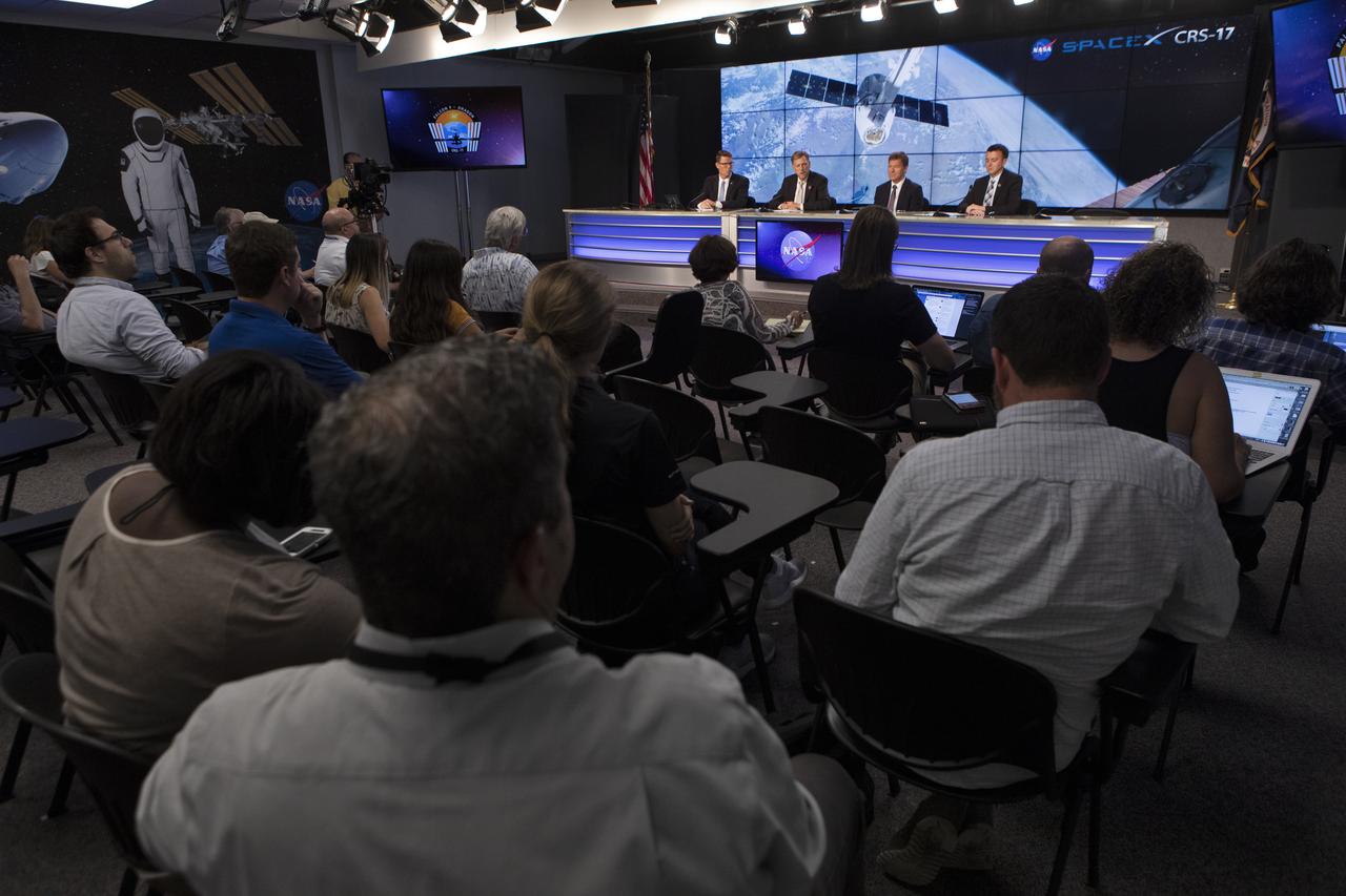 Members of the news media attend a prelaunch news conference for SpaceX’s 17th Commercial Resupply Services (CRS-17) mission to the International Space Station for NASA on May 2, 2019, at the agency’s Kennedy Space Center in Florida. From left, are Derrol Nail, NASA Communications moderator; Kenny Todd, Manager, International Space Station Operations and Integration at NASA’s Johnson Space Center in Houston; Hans Koenigsmann, VP, Build and Flight Reliability with SpaceX; and Will Ulrich, 45th launch weather officer with the U.S. Air Force.  The SpaceX Falcon 9 rocket and Dragon cargo module are scheduled to launch no earlier than May 3, 2019, from Space Launch Complex 40 on Cape Canaveral Air Force Station in Florida.