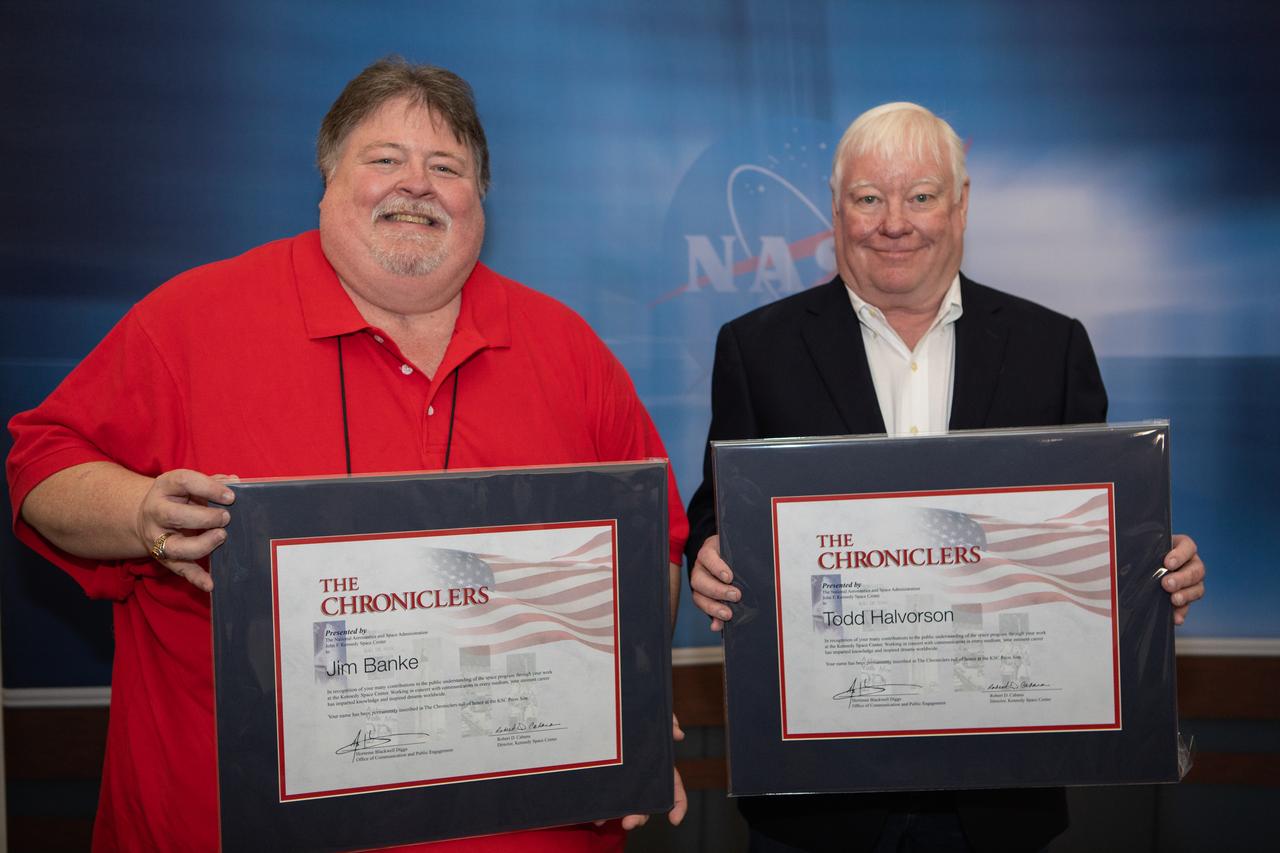 Jim Banke, left, and Todd Halvorson were honored as Chroniclers during a ceremony May 3, 2019, at Kennedy Space Center’s NASA News Center. The duo covered the space program together for Florida Today for 12 years. Also inducted as members were radio broadcaster Vic Ratner and photojournalist Peter Cosgrove. They were selected by a committee of their peers on March 25. The Chroniclers recognizes retirees of the news and communications business who have helped spread the news of American space exploration from Kennedy for 10 years or more. 