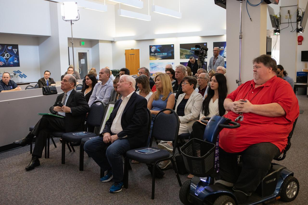 Four honorees were added as members to The Chroniclers during a ceremony May 3, 2019, at Kennedy Space Center’s NASA News Center. From left to right in the front row are Vic Ratner, Todd Halvorson and Jim Banke. A photograph of Peter Cosgrove also was placed in the front row in his memory, as he passed away earlier in 2019. They were selected by a committee of their peers on March 25. The Chroniclers recognizes retirees of the news and communications business who have helped spread news of American space exploration from Kennedy for 10 years or more. 