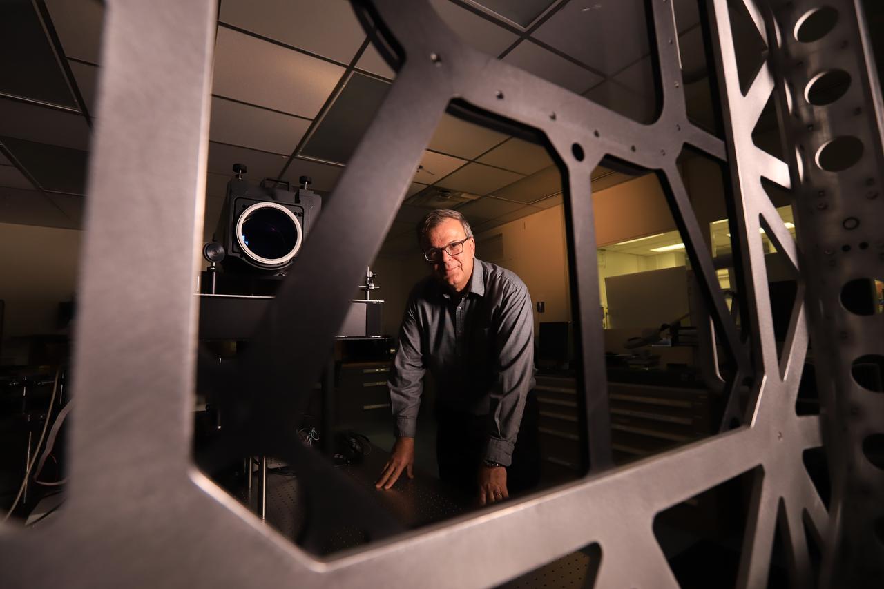 Mark Nurge, a physicist in Kennedy Space Center’s Applied Physics Lab, stands near a laser interferometer, which is used to determine if there are acceptable levels of distortion and imperfections in windows. Nurge recently completed optical metrology testing and evaluation of all flight windows on the Orion capsule for Artemis 1. The interferometer uses a laser source to do wavefront and transmission measurements, as well as evaluation of the color balance. Artemis 1 is an uncrewed flight that will pave the way for future crewed missions and enable future missions to the Moon, Mars, and beyond.