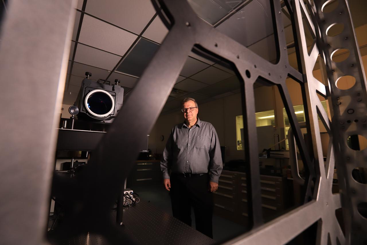 Mark Nurge, a physicist in Kennedy Space Center’s Applied Physics Lab, stands near a laser interferometer, which is used to determine if there are acceptable levels of distortion and imperfections in windows. Nurge recently completed optical metrology testing and evaluation of all flight windows on the Orion capsule for Artemis 1. The interferometer uses a laser source to do wavefront and transmission measurements, as well as evaluation of the color balance. Artemis 1 is an uncrewed flight that will pave the way for future crewed missions and enable future missions to the Moon, Mars, and beyond.