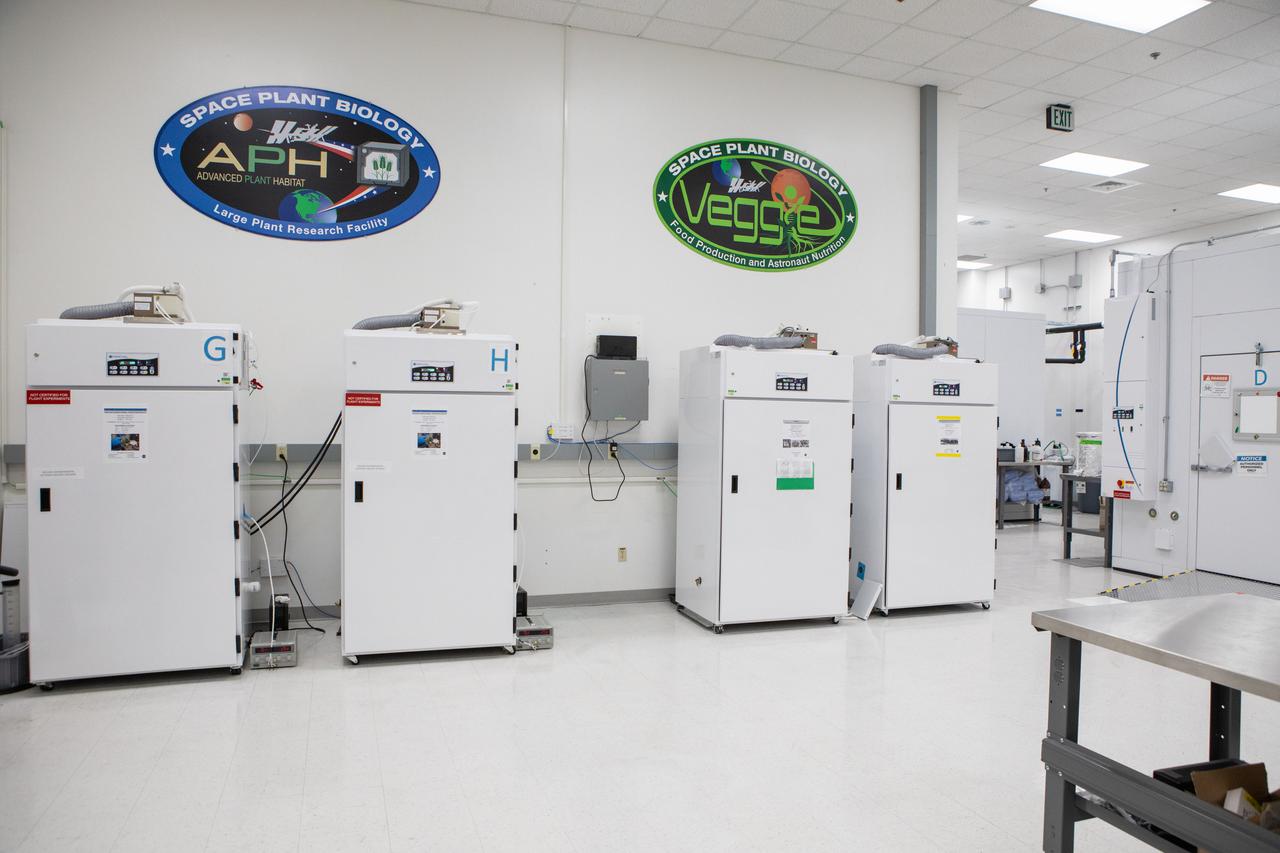 Ground unit experiment chambers for the Veggie plant growth system and the Advanced Plant Habitat are in view in a laboratory inside the Space Station Processing Facility (SSPF) at NASA’s Kennedy Space Center in Florida, on May 16, 2019. The center is celebrating the SSPF’s 25th anniversary. The facility was built to process elements for the International Space Station. Now it is providing support for current and future NASA and commercial provider programs, including Commercial Resupply Services, Artemis 1, sending the first woman and next man to the Moon, and deep space destinations including Mars.
