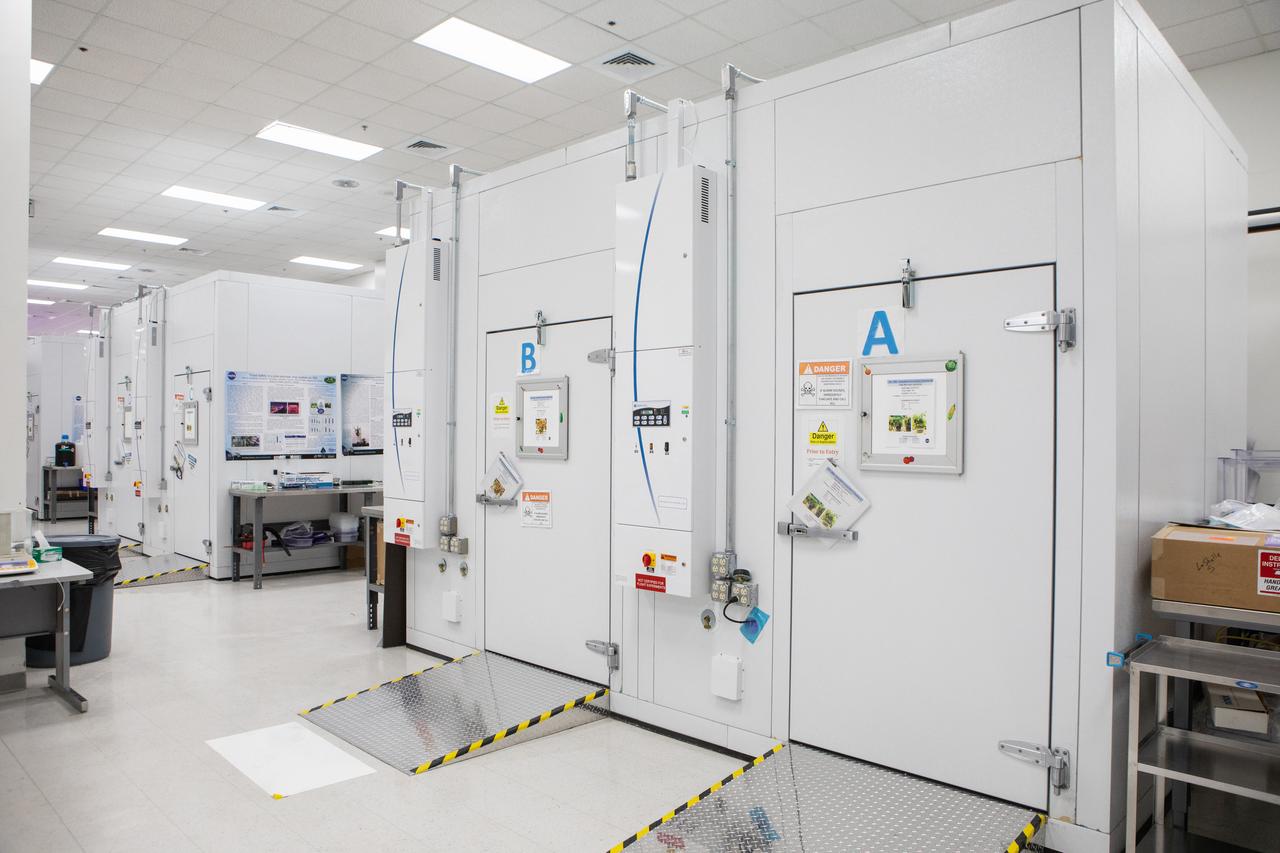 A view of the Veggie and Advanced Plant Habitat walk-in experiment chambers in a laboratory inside the Space Station Processing Facility (SSPF) at NASA's Kennedy Space Center in Florida, on May 16, 2019. The center is celebrating the SSPF’s 25th anniversary. The facility was built to process elements for the International Space Station. Now it is providing support for current and future NASA and commercial provider programs, including Commercial Resupply Services, Artemis 1, sending the first woman and next man to the Moon, and deep space destinations including Mars. 
