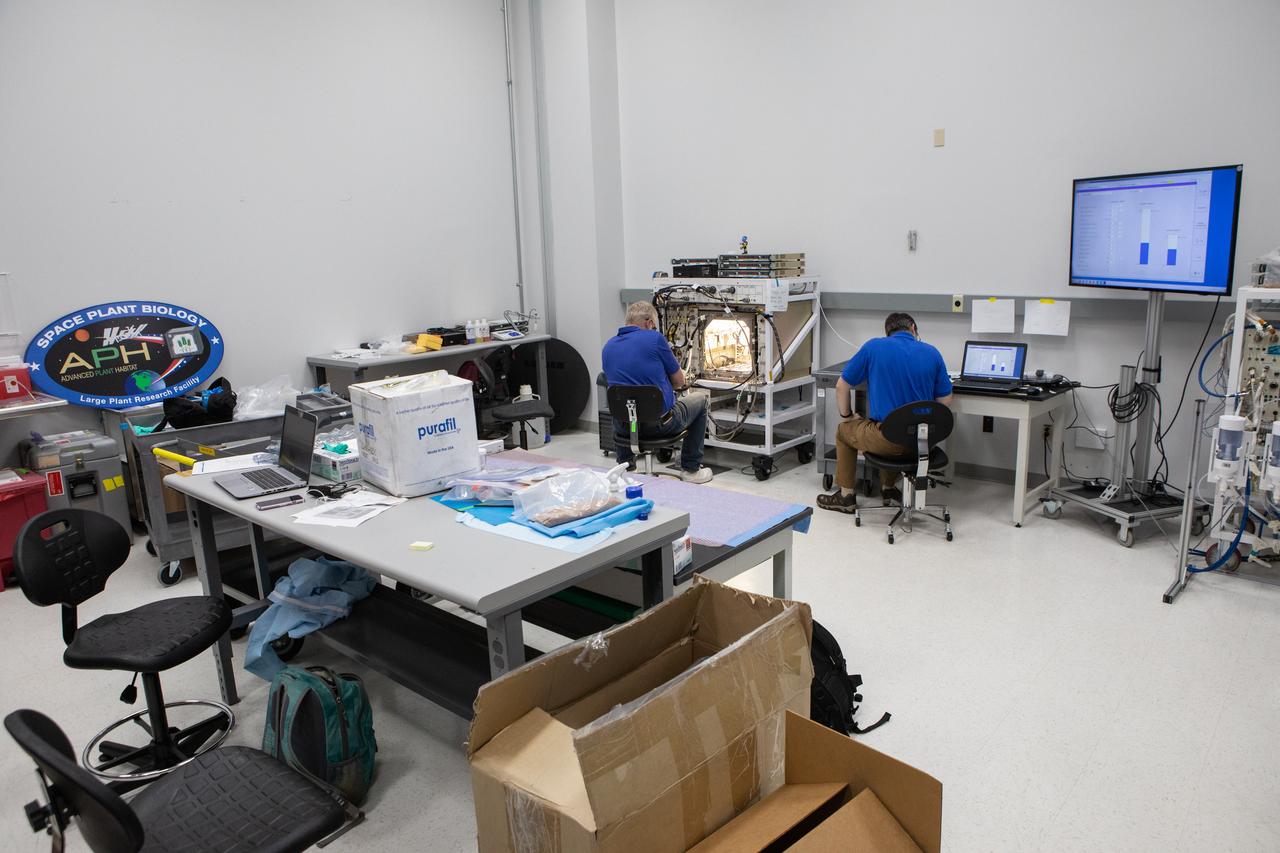 Researchers are testing plant growth in a ground unit of the Advanced Plant Habitat inside a laboratory in the Space Station Processing Facility (SSPF) at NASA's Kennedy Space Center in Florida, on May 16, 2019. The center is celebrating the SSPF’s 25th anniversary. The facility was built to process elements for the International Space Station. Now it is providing support for current and future NASA and commercial provider programs, including Commercial Resupply Services, Artemis 1, sending the first woman and next man to the Moon, and deep space destinations including Mars.