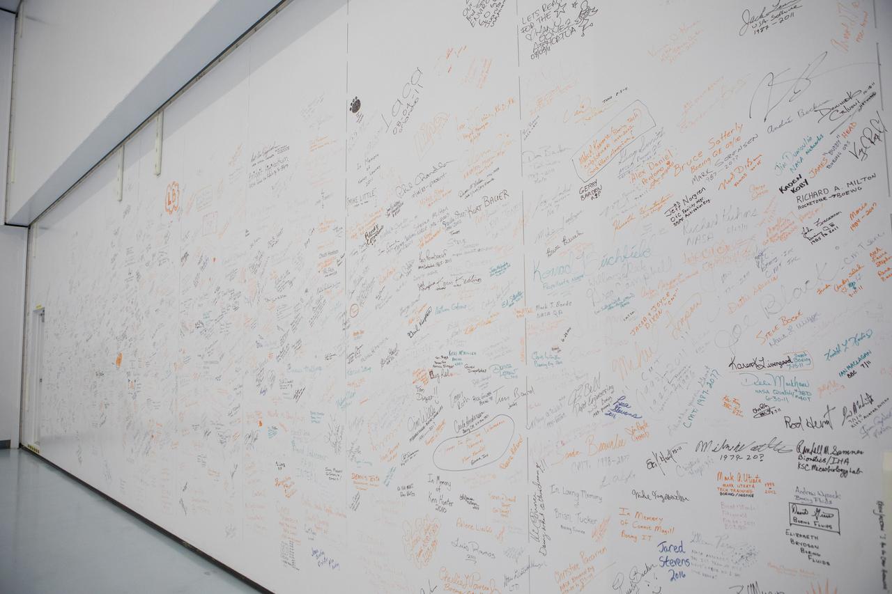 A photograph taken on May 16, 2019, shows a wall inside the Space Station Processing Facility (SSPF) at NASA's Kennedy Space Center in Florida, containing signatures of many of those who worked on the International Space Station Program.  The center is celebrating the SSPF’s 25th anniversary. The facility was built to process elements for the space station. Now it is providing support for current and future NASA and commercial provider programs, including Commercial Resupply Services, Artemis 1, sending the first woman and next man to the Moon, and deep space destinations including Mars.