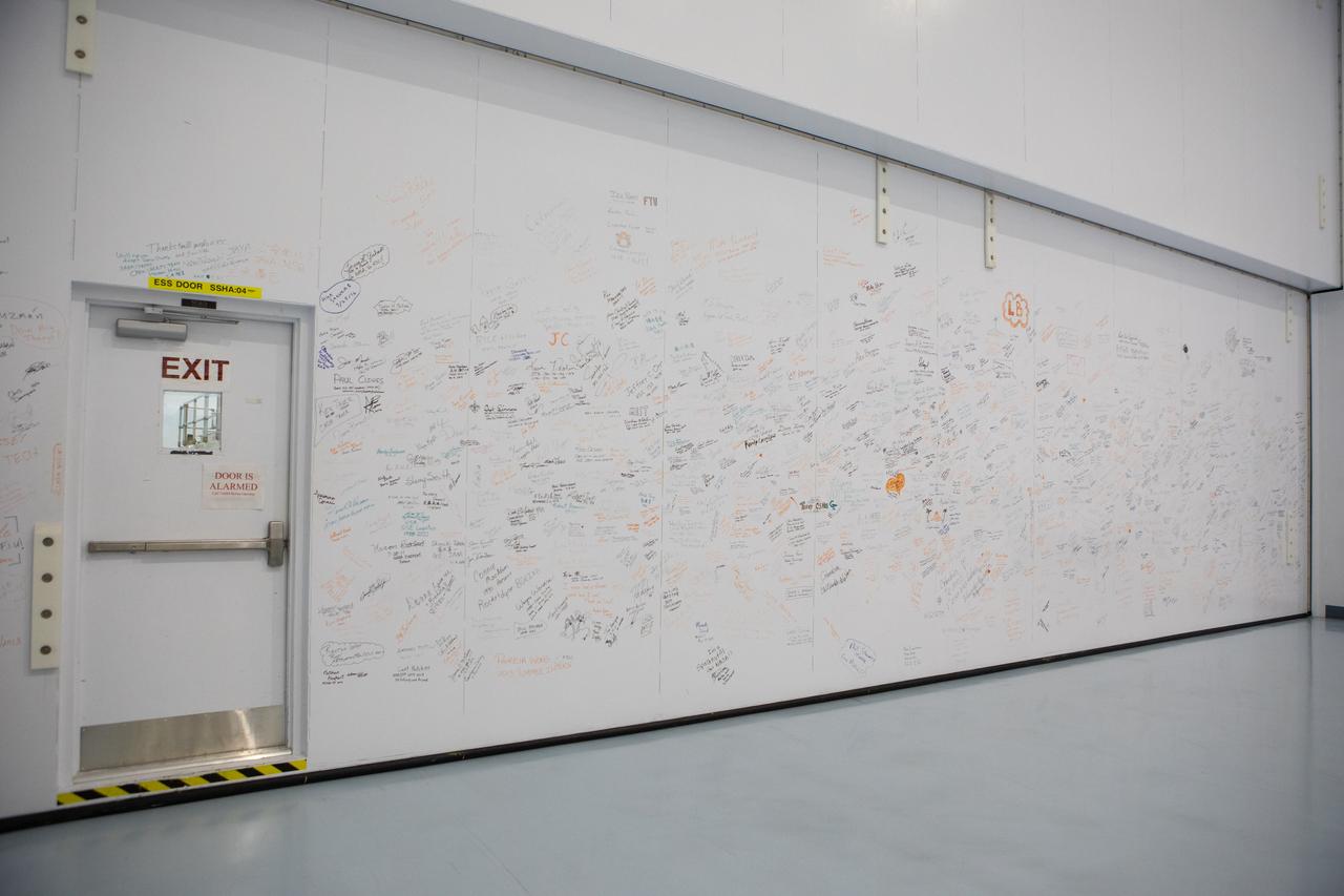 A photograph taken on May 16, 2019, shows a wall inside the Space Station Processing Facility (SSPF) at NASA's Kennedy Space Center in Florida, containing signatures of many of those who worked on the International Space Station Program.  The center is celebrating the SSPF’s 25th anniversary. The facility was built to process elements for the space station. Now it is providing support for current and future NASA and commercial provider programs, including Commercial Resupply Services, Artemis 1, sending the first woman and next man to the Moon, and deep space destinations including Mars.
