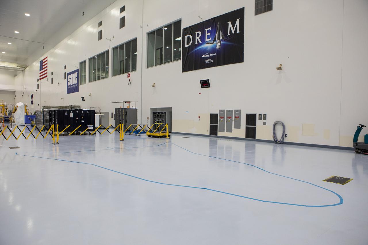 In view in this photograph, taken on May 16, 2019, is the area where the Sierra Nevada Corporation will process its Dream Chaser spacecraft in the high bay of the Space Station Processing Facility (SSPF) at NASA's Kennedy Space Center in Florida. The center is celebrating the SSPF’s 25th anniversary. The facility was built to process elements for the International Space Station. Now it is providing support for current and future NASA and commercial provider programs, including Commercial Resupply Services, Artemis 1, sending the first woman and next man to the Moon, and deep space destinations including Mars.