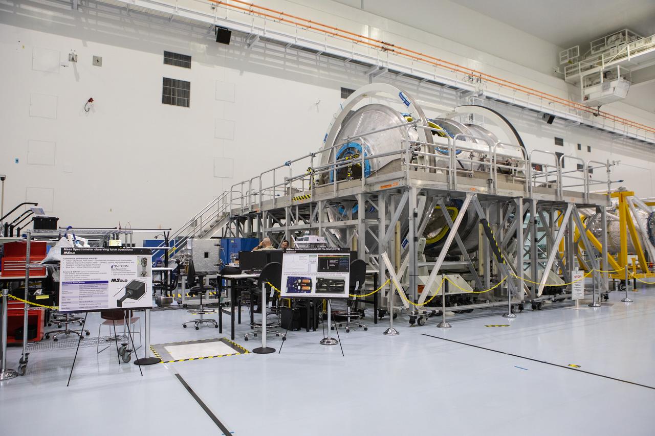 Instruments for NASA’s Mars Spectrometer observing lunar operations (MSolo) are in view at left in the high bay of the Space Station Processing Facility (SSPF) at NASA's Kennedy Space Center in Florida, on May 16, 2019. The center is celebrating the SSPF’s 25th anniversary. The facility was built to process elements for the International Space Station. Now it is providing support for current and future NASA and commercial provider programs, including Commercial Resupply Services, Artemis 1, sending the first woman and next man to the Moon, and deep space destinations including Mars.