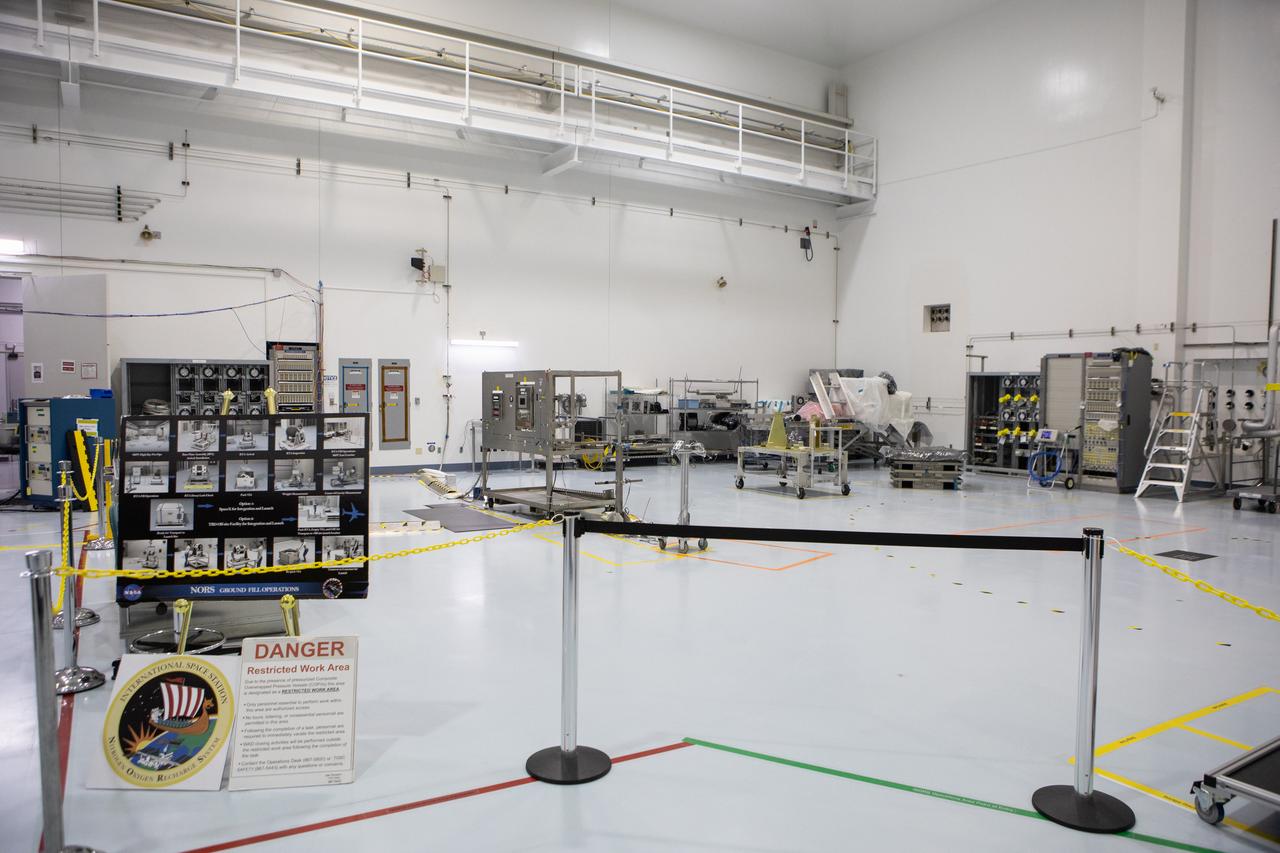 The processing area for the Nitrogen Oxygen Recharge System (NORS) for the International Space Station, is in view in the high bay of the Space Station Processing Facility (SSPF) at NASA's Kennedy Space Center in Florida, on May 16, 2019. NORS are tanks that are used to fill the oxygen and nitrogen tanks that supply the needed gases to the station’s airlock for spacewalks and also are used as a secondary method to replenish the atmosphere inside the space station. The center is celebrating the SSPF’s 25th anniversary. The SSPF was built to process elements for the space station. Now it is providing support for current and future NASA and commercial provider programs, including Commercial Resupply Services, Artemis 1, sending the first woman and next man to the Moon, and deep space destinations including Mars.