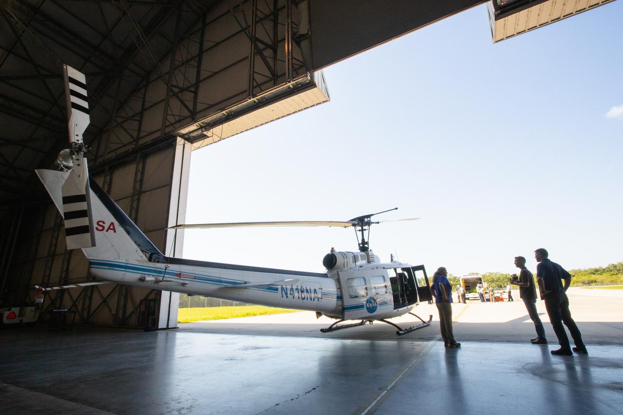 Kennedy Space Center personnel and American Medical Response (AMR) contractor paramedics gather near a NASA helicopter during a medical support training course in the Space Florida hangar at the spaceport’s Shuttle Landing Facility on May 17, 2019. The course was designed to familiarize the AMR paramedics with the center’s Triage Forces deployment, which included medical team members, fire/rescue personnel, environmental health specialists and flight operations crew members, as well as a helicopter, Mine Resistant Ambush Protected (MRAP) tactical vehicle, fire pumper truck and triage vehicles. The AMR paramedics will assist the agency in contingency planning for the return of human spaceflight from Kennedy.