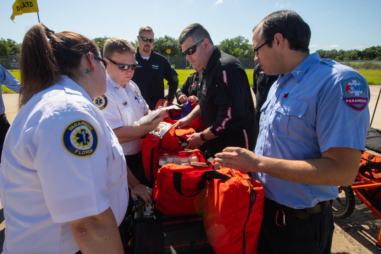 Kennedy Space Center personnel and American Medical Response (AMR) contractor paramedics participate in a medical support training course at the Florida spaceport’s Shuttle Landing Facility on May 17, 2019. The course was designed to familiarize the AMR paramedics with the center’s Triage Forces deployment, which included medical team members, fire/rescue personnel, environmental health specialists and flight operations crew members, as well as a helicopter, Mine Resistant Ambush Protected (MRAP) tactical vehicle, fire pumper truck and triage vehicles. The AMR paramedics will assist the agency in contingency planning for the return of human spaceflight from Kennedy.