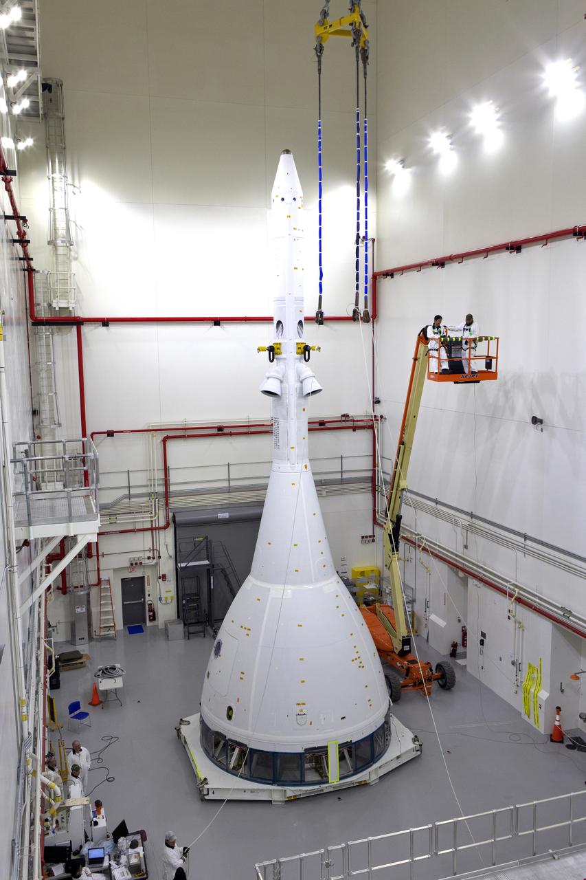 Inside the Launch Abort System Facility (LASF) at NASA’s Kennedy Space Center in Florida, workers are completing the integration of a test version of the Orion crew module with the Launch Abort System (LAS) on May 18, 2019. The test vehicle and the LAS will be used for the Orion Ascent Abort-2 (AA-2) Flight Test. AA-2 is a full-stress test of the LAS, planned for July 2. AA-2 will launch from Space Launch Complex 46, carrying a fully functional LAS and a 22,000-pound Orion test vehicle to an altitude of 31,000 feet and traveling at more than 1,000 miles an hour. The test will verify the LAS can steer the crew module and astronauts aboard to safety if an emergency occurs during ascent on the Space Launch System (SLS) rocket. NASA's Orion and Exploration Ground Systems programs, contractors Jacob's, Lockheed Martin and Northrop Grumman, in conjunction with the Air Force Space and Missile Center's Launch Operations branch and the 45th Space Wing are performing flight operations for AA-2.
