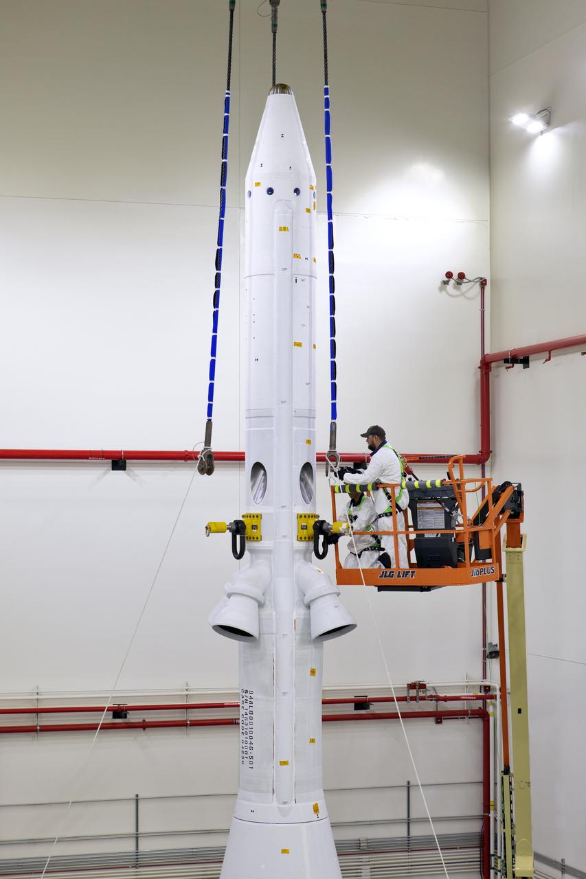 Inside the Launch Abort System Facility (LASF) at NASA’s Kennedy Space Center in Florida, workers are completing the integration of a test version of the Orion crew module with the Launch Abort System (LAS) on May 18, 2019. In view are the LAS attitude control motor, jettison motor and abort motor. The test vehicle and the LAS will be used for the Orion Ascent Abort-2 (AA-2) Flight Test. AA-2 is a full-stress test of the LAS, planned for July 2. AA-2 will launch from Space Launch Complex 46, carrying a fully functional LAS and a 22,000-pound Orion test vehicle to an altitude of 31,000 feet and traveling at more than 1,000 miles an hour. The test will verify the LAS can steer the crew module and astronauts aboard to safety if an emergency occurs during ascent on the Space Launch System (SLS) rocket. NASA's Orion and Exploration Ground Systems programs, contractors Jacob's, Lockheed Martin and Northrop Grumman, in conjunction with the Air Force Space and Missile Center's Launch Operations branch and the 45th Space Wing are performing flight operations for AA-2.