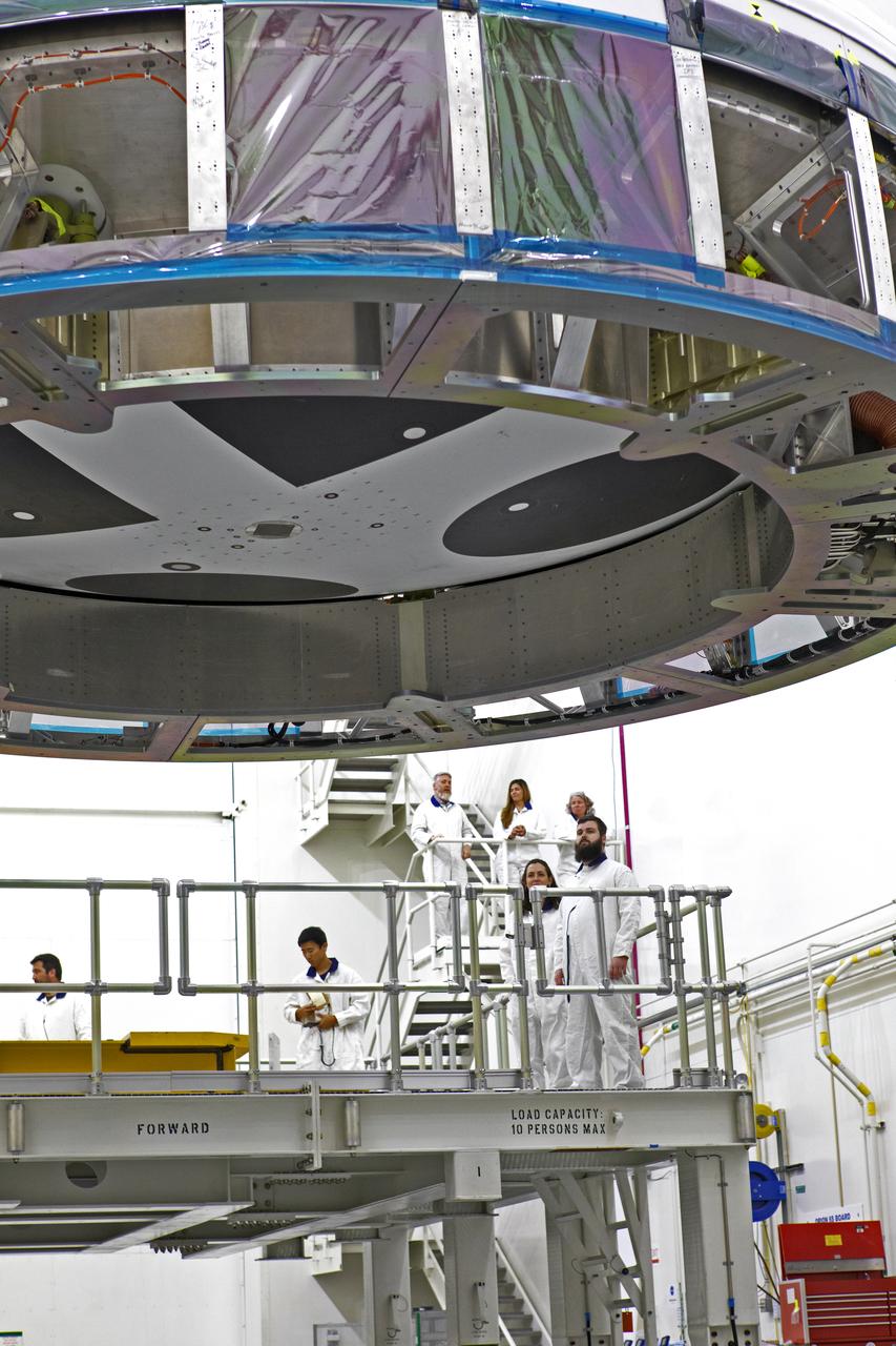 Inside the Launch Abort System Facility (LASF) at NASA’s Kennedy Space Center in Florida, workers are completing the integration of a test version of the Orion crew module with the Launch Abort System (LAS) on May 18, 2019. The test vehicle and the LAS will be used for the Orion Ascent Abort-2 (AA-2) Flight Test. AA-2 is a full-stress test of the LAS, planned for July 2. AA-2 will launch from Space Launch Complex 46, carrying a fully functional LAS and a 22,000-pound Orion test vehicle to an altitude of 31,000 feet and traveling at more than 1,000 miles an hour. The test will verify the LAS can steer the crew module and astronauts aboard to safety if an emergency occurs during ascent on the Space Launch System (SLS) rocket. NASA's Orion and Exploration Ground Systems programs, contractors Jacob's, Lockheed Martin and Northrop Grumman, in conjunction with the Air Force Space and Missile Center's Launch Operations branch and the 45th Space Wing are performing flight operations for AA-2.
