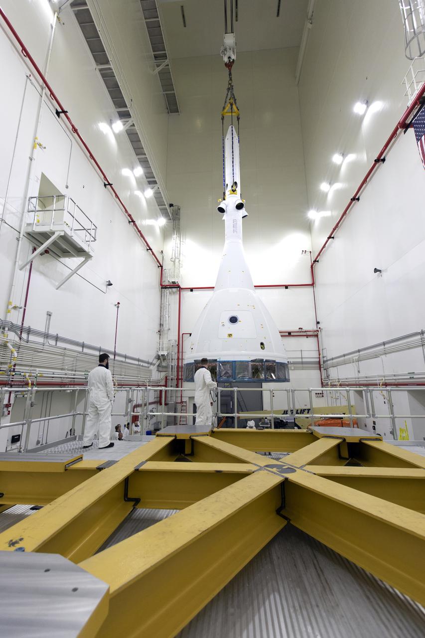 Inside the Launch Abort System Facility (LASF) at NASA’s Kennedy Space Center in Florida, workers are completing the integration of a test version of the Orion crew module with the Launch Abort System (LAS) on May 18, 2019. The test vehicle and the LAS will be used for the Orion Ascent Abort-2 (AA-2) Flight Test. AA-2 is a full-stress test of the LAS, planned for July 2. AA-2 will launch from Space Launch Complex 46, carrying a fully functional LAS and a 22,000-pound Orion test vehicle to an altitude of 31,000 feet and traveling at more than 1,000 miles an hour. The test will verify the LAS can steer the crew module and astronauts aboard to safety if an emergency occurs during ascent on the Space Launch System (SLS) rocket. NASA's Orion and Exploration Ground Systems programs, contractors Jacob's, Lockheed Martin and Northrop Grumman, in conjunction with the Air Force Space and Missile Center's Launch Operations branch and the 45th Space Wing are performing flight operations for AA-2.