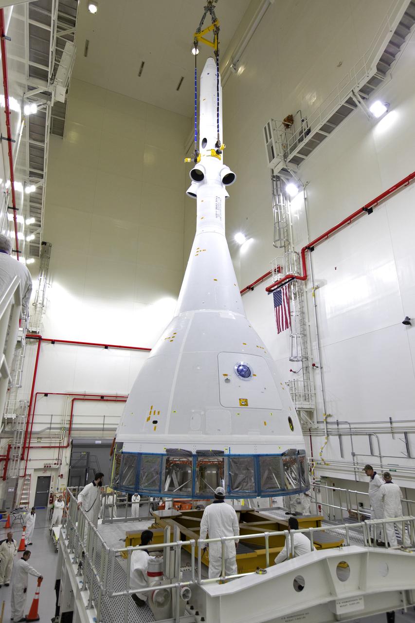 Inside the Launch Abort System Facility (LASF) at NASA’s Kennedy Space Center in Florida, workers are completing the integration of a test version of the Orion crew module with the Launch Abort System (LAS) on May 18, 2019. The test vehicle and the LAS will be used for the Orion Ascent Abort-2 (AA-2) Flight Test. AA-2 is a full-stress test of the LAS, planned for July 2. AA-2 will launch from Space Launch Complex 46, carrying a fully functional LAS and a 22,000-pound Orion test vehicle to an altitude of 31,000 feet and traveling at more than 1,000 miles an hour. The test will verify the LAS can steer the crew module and astronauts aboard to safety if an emergency occurs during ascent on the Space Launch System (SLS) rocket. NASA's Orion and Exploration Ground Systems programs, contractors Jacob's, Lockheed Martin and Northrop Grumman, in conjunction with the Air Force Space and Missile Center's Launch Operations branch and the 45th Space Wing are performing flight operations for AA-2.