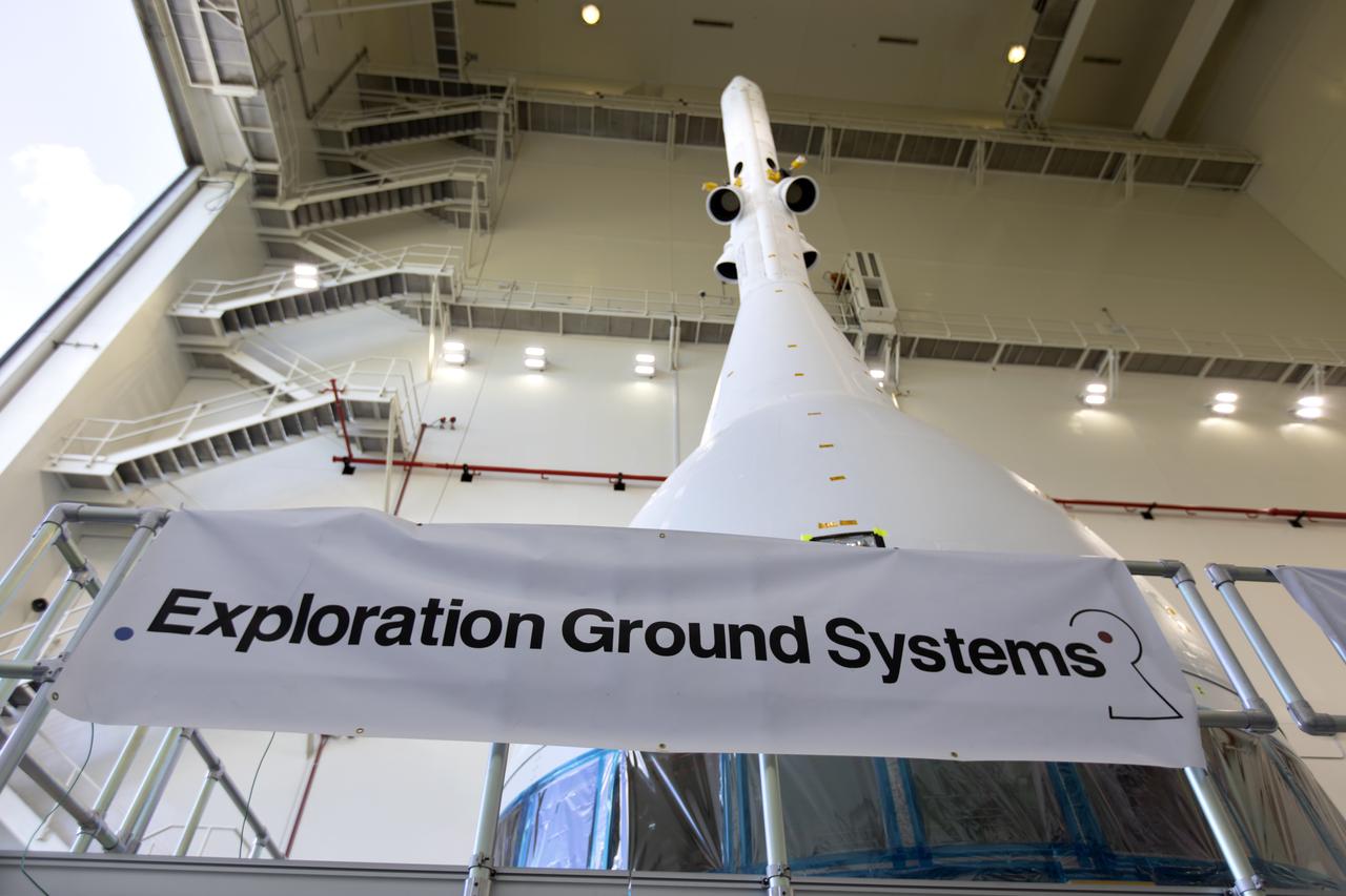 The test version of Orion attached to the Launch Abort System for the Ascent Abort-2 (AA-2) flight test exits the Launch Abort System Facility at NASA’s Kennedy Space Center in Florida on May 22, 2019. The flight test article will make the 21.5 mile trek to Space Launch Complex 46 at Cape Canaveral Air Force Station in preparation for its launch this summer. During AA-2, a test version of Orion will launch on a booster to more than six miles in altitude, where Orion’s launch abort system will pull the capsule and its crew away to safety if an emergency occurs during ascent on the Space Launch System rocket. The AA-2 elements will be stacked together at the launch pad over the next several weeks. The launch is planned for July 2 and is a critical safety test that helps pave the way for Artemis missions near the Moon, and will enable astronauts to set foot on the lunar surface by 2024.