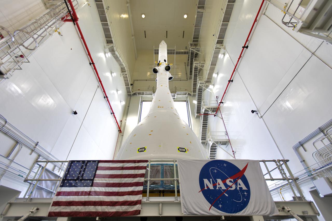 The test version of Orion attached to the Launch Abort System for the Ascent Abort-2 (AA-2) flight test exits the Launch Abort System Facility at NASA’s Kennedy Space Center in Florida on May 22, 2019. The flight test article will make the 21.5 mile trek to Space Launch Complex 46 at Cape Canaveral Air Force Station in preparation for its launch this summer. During AA-2, a test version of Orion will launch on a booster to more than six miles in altitude, where Orion’s launch abort system will pull the capsule and its crew away to safety if an emergency occurs during ascent on the Space Launch System rocket. The AA-2 elements will be stacked together at the launch pad over the next several weeks. The launch is planned for July 2 and is a critical safety test that helps pave the way for Artemis missions near the Moon, and will enable astronauts to set foot on the lunar surface by 2024.