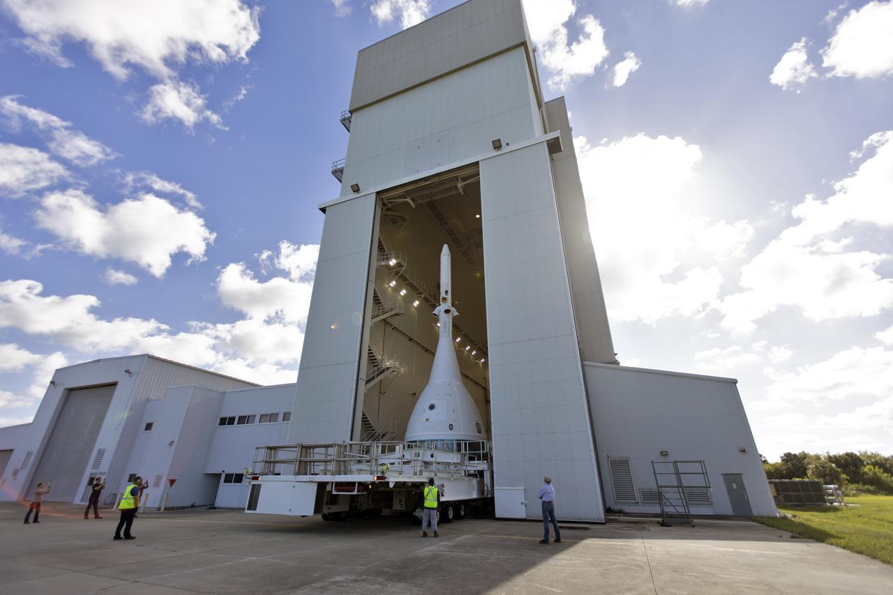 The vehicle for Orion’s Ascent Abort-2 (AA-2) flight test exits the Launch Abort System Facility at NASA’s Kennedy Space Center in Florida on May 22, 2019. The flight test article will make the 21.5 mile trek to Space Launch Complex 46 at Cape Canaveral Air Force Station in preparation for its launch this summer. During AA-2, a test version of Orion will launch on a booster to more than six miles in altitude, where Orion’s launch abort system will pull the capsule away to demonstrate it can keep a future crew inside safe if an emergency occurs during ascent on the Space Launch System rocket. The AA-2 elements will be stacked together at the launch pad over the next several weeks. The launch is planned for July 2 and is a critical safety test that helps pave the way for Artemis missions near the Moon, and will enable astronauts to set foot on the lunar surface by 2024.