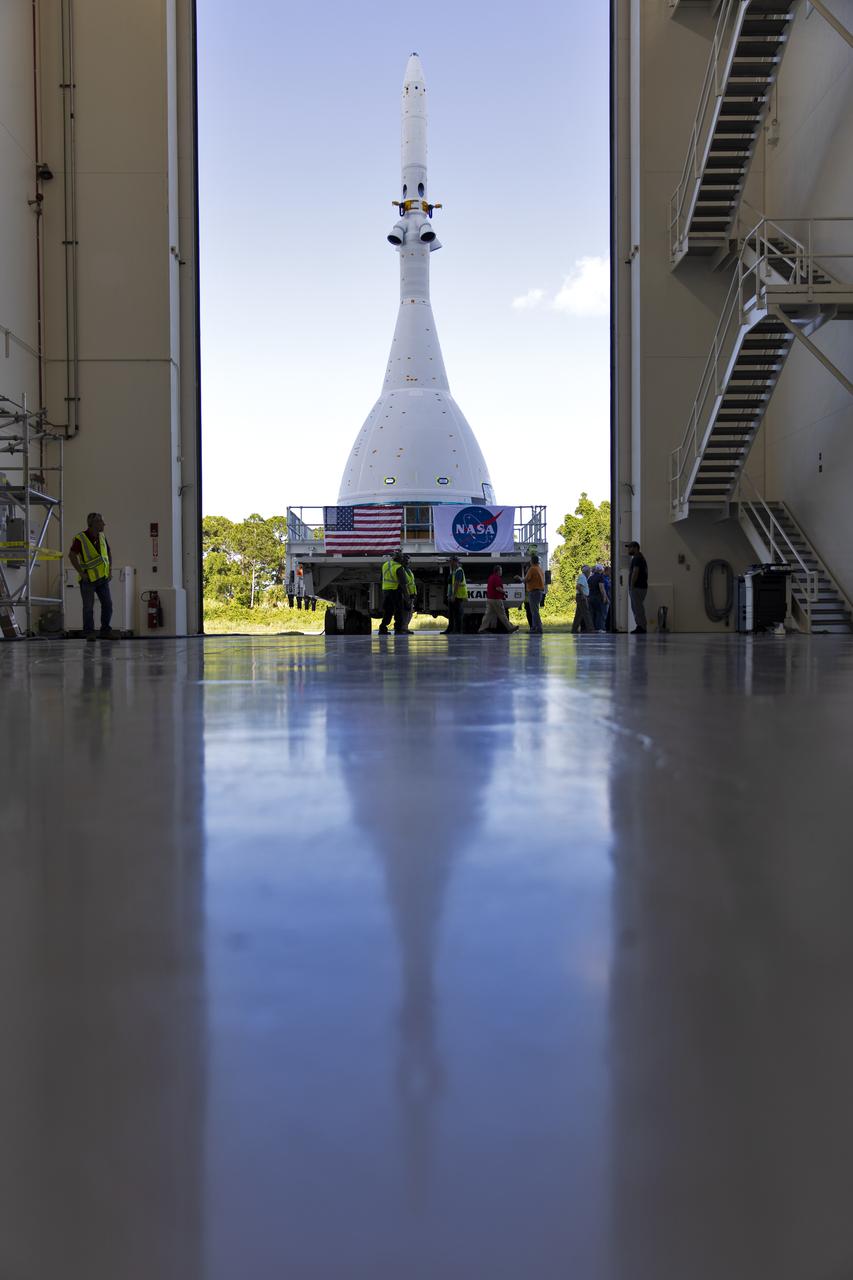 The test version of Orion attached to the Launch Abort System for the Ascent Abort-2 (AA-2) flight test exits the Launch Abort System Facility at NASA’s Kennedy Space Center in Florida on May 22, 2019. The flight test article will make the 21.5 mile trek to Space Launch Complex 46 at Cape Canaveral Air Force Station in preparation for its launch this summer. During AA-2, a test version of Orion will launch on a booster to more than six miles in altitude, where Orion’s launch abort system will pull the capsule and its crew away to safety if an emergency occurs during ascent on the Space Launch System rocket. The AA-2 elements will be stacked together at the launch pad over the next several weeks. The launch is planned for July 2 and is a critical safety test that helps pave the way for Artemis missions near the Moon, and will enable astronauts to set foot on the lunar surface by 2024.
