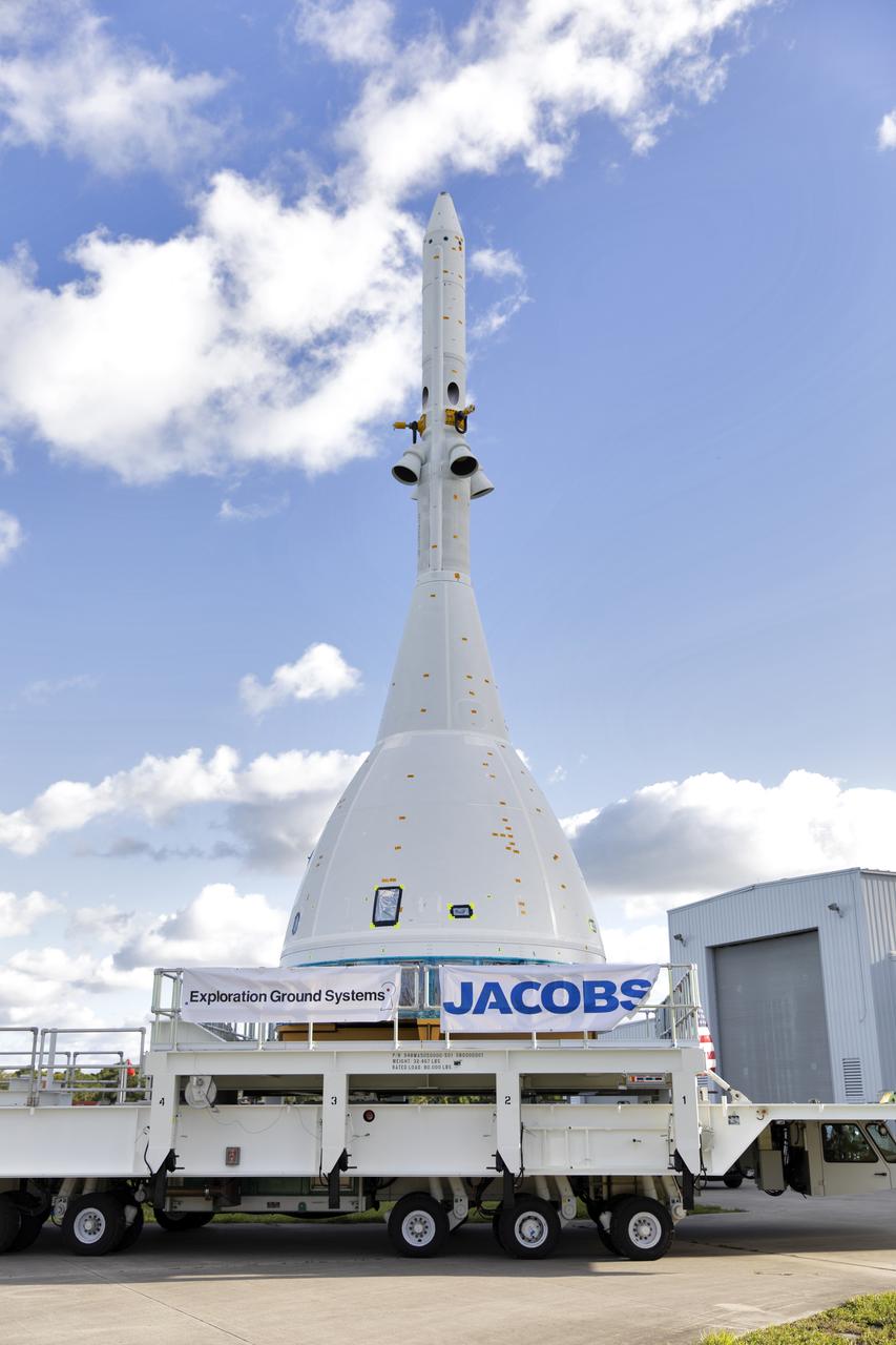 The test version of Orion attached to the Launch Abort System for the Ascent Abort-2 (AA-2) flight test exited the Launch Abort System Facility at NASA’s Kennedy Space Center in Florida on May 22, 2019. The flight test article will make the 21.5 mile trek to Space Launch Complex 46 at Cape Canaveral Air Force Station in preparation for its launch this summer. During AA-2, a test version of Orion will launch on a booster to more than six miles in altitude, where Orion’s launch abort system will pull the capsule and its crew away to safety if an emergency occurs during ascent on the Space Launch System rocket. The AA-2 elements will be stacked together at the launch pad over the next several weeks. The launch is planned for July 2 and is a critical safety test that helps pave the way for Artemis missions near the Moon, and will enable astronauts to set foot on the lunar surface by 2024.