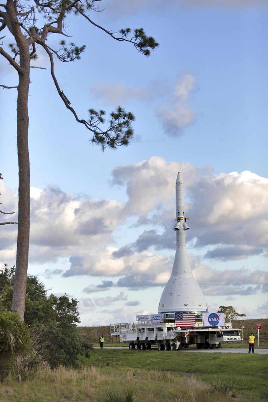 After exiting the Launch Abort System Facility at NASA’s Kennedy Space Center in Florida on May 22, 2019, the test version of Orion attached to the Launch Abort System for the Ascent Abort-2 (AA-2) flight test is moved on a transport along the 21.5 mile trek to Space Launch Complex 46 at Cape Canaveral Air Force Station in preparation for its launch this summer. During AA-2, a test version of Orion will launch on a booster to more than six miles in altitude, where Orion’s launch abort system will pull the capsule and its crew away to safety if an emergency occurs during ascent on the Space Launch System rocket. The AA-2 elements will be stacked together at the launch pad over the next several weeks. The launch is planned for July 2 and is a critical safety test that helps pave the way for Artemis missions near the Moon, and will enable astronauts to set foot on the lunar surface by 2024.