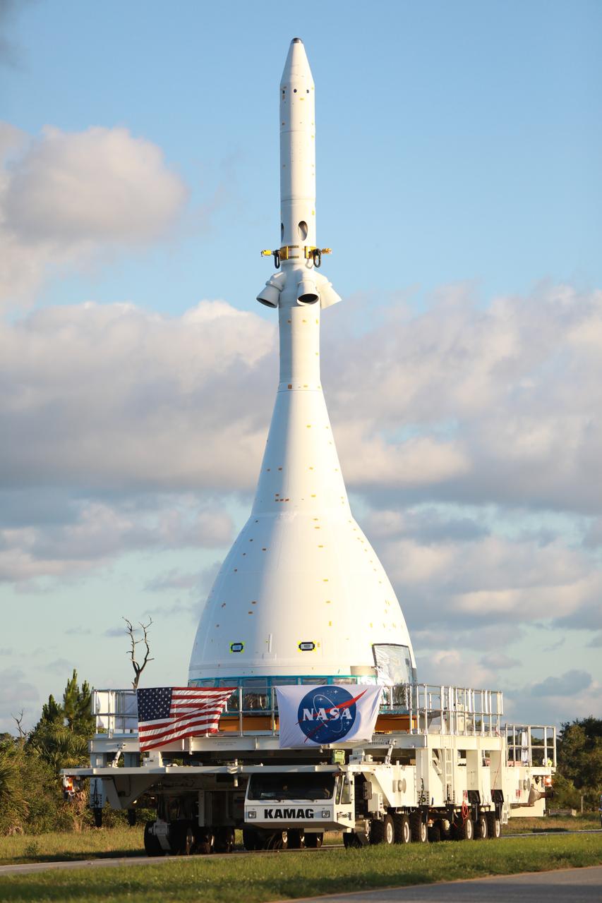The vehicle for Orion’s Ascent Abort-2 (AA-2) flight test is moved along a route from NASA’s Kennedy Space Center in Florida, to Space Launch Complex 46 at Cape Canaveral Air Force Station on May 22, 2019, in preparation for its launch this summer. During AA-2, a test version of Orion will launch on a booster to more than six miles in altitude, where Orion’s launch abort system will pull the capsule away to demonstrate it can keep a future crew inside safe if an emergency occurs during ascent on the Space Launch System rocket. The AA-2 elements will be stacked together at the launch pad over the next several weeks. The launch is planned for July 2 and is a critical safety test that helps pave the way for Artemis missions near the Moon, and will enable astronauts to set foot on the lunar surface by 2024.