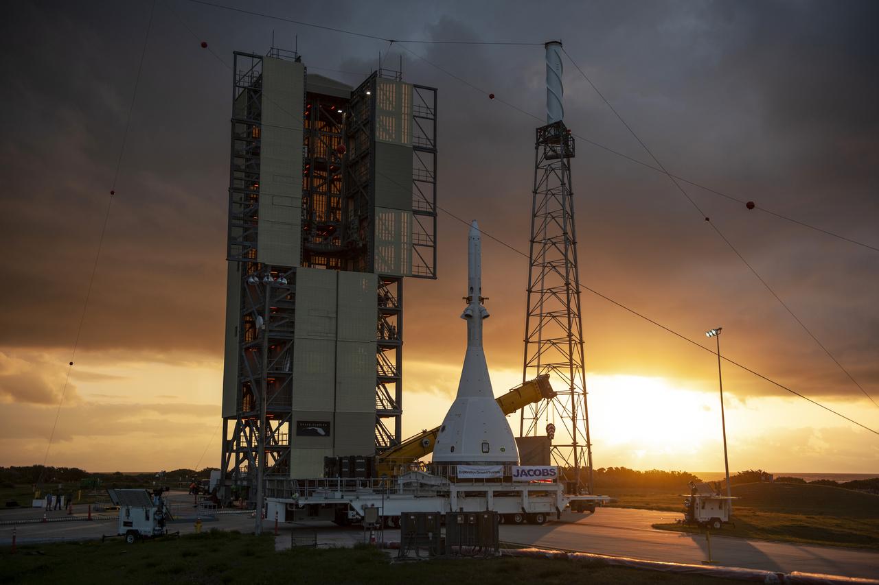 The test version of Orion attached to the Launch Abort System for the Ascent Abort-2 (AA-2) flight test arrives at Space Launch Complex 46 at Cape Canaveral Air Force Station in Florida on May 23, 2019. The flight test article will be hoisted up and moved inside the vertical integration facility for stacking atop the booster. The booster was procured by the U.S. Air Force and manufactured by Northrop Grumman. During AA-2, targeted for July 2, the LAS with Orion will launch on the booster more than six miles in altitude, where Orion’s launch abort system will pull the capsule and its crew away to safety if an emergency occurs during ascent on the Space Launch System rocket. AA-2 is a critical safety test that helps pave the way for Artemis missions near the Moon, and will enable astronauts to set foot on the lunar surface by 2024.