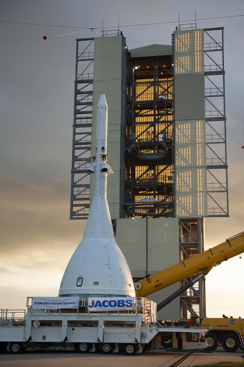 The test version of Orion attached to the Launch Abort System for the Ascent Abort-2 (AA-2) flight test arrives at Space Launch Complex 46 at Cape Canaveral Air Force Station in Florida on May 23, 2019. The flight test article will be hoisted up and moved inside the vertical integration facility for stacking atop the booster. The booster was procured by the U.S. Air Force and manufactured by Northrop Grumman. During AA-2, targeted for July 2, the LAS with Orion will launch on the booster more than six miles in altitude, where Orion’s launch abort system will pull the capsule and its crew away to safety if an emergency occurs during ascent on the Space Launch System rocket. AA-2 is a critical safety test that helps pave the way for Artemis missions near the Moon, and will enable astronauts to set foot on the lunar surface by 2024.