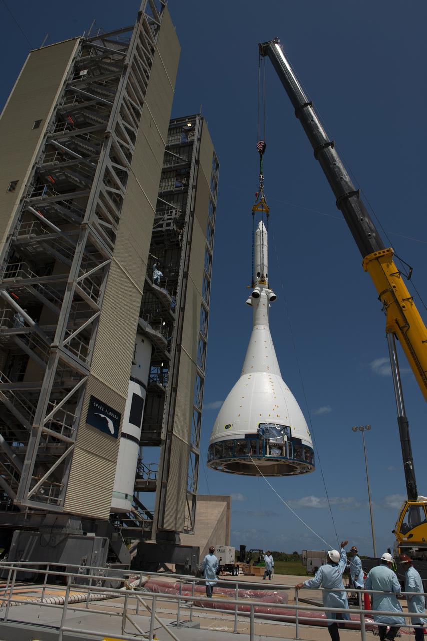 The test version of Orion attached to the Launch Abort System for the Ascent Abort-2 (AA-2) flight test is hoisted up by crane at Space Launch Complex 46 at Cape Canaveral Air Force Station in Florida on May 23, 2019. The flight test article will be moved inside the vertical integration facility for stacking atop the booster. The booster was procured by the U.S. Air Force and manufactured by Northrop Grumman. During AA-2, targeted for July 2, the LAS with Orion will launch on the booster more than six miles in altitude, where Orion’s launch abort system will pull the capsule and its crew away to safety if an emergency occurs during ascent on the Space Launch System rocket. AA-2 is a critical safety test that helps pave the way for Artemis missions near the Moon, and will enable astronauts to set foot on the lunar surface by 2024.