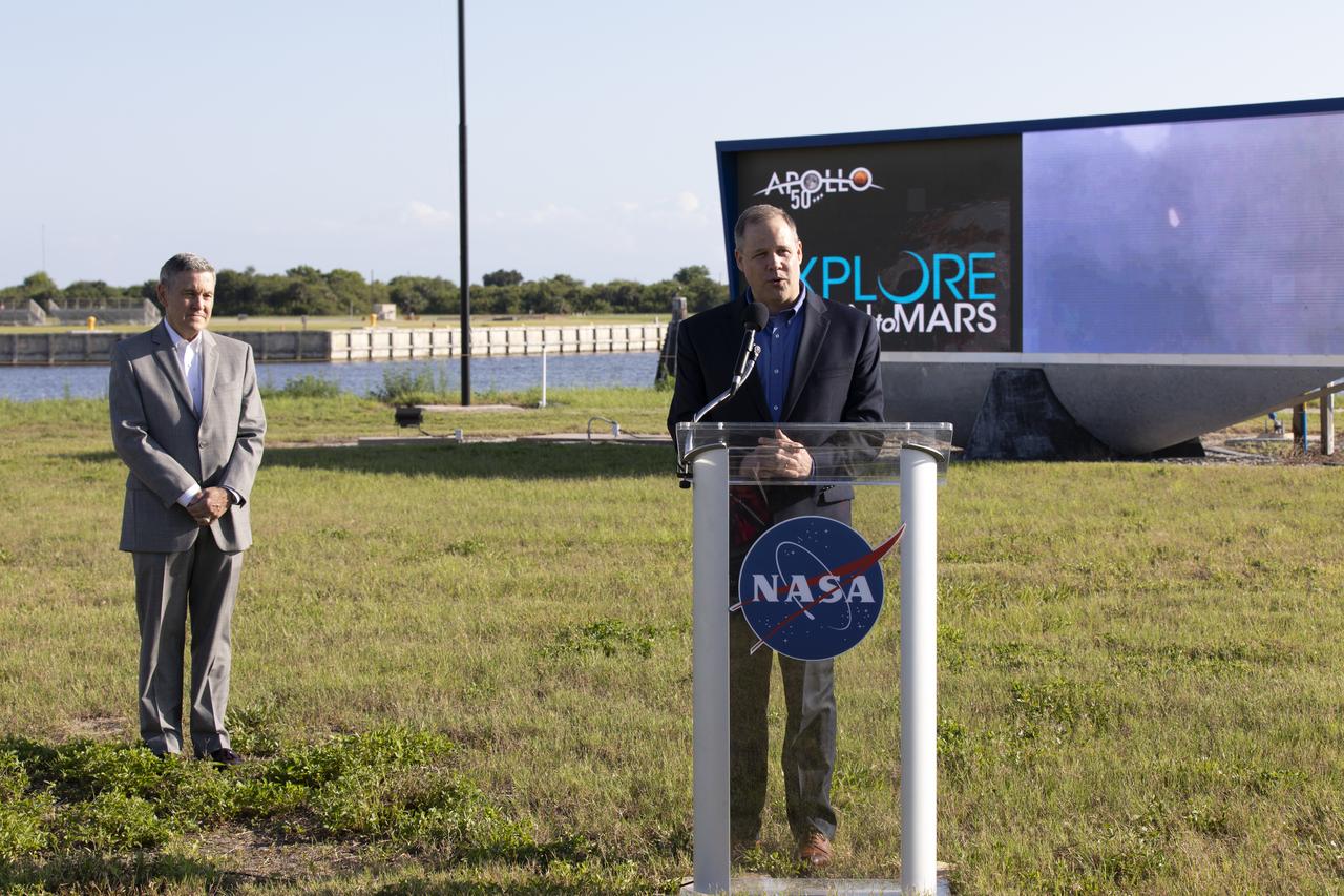 NASA Administrator Jim Bridenstine speaks to members of the news media at the NASA News Center on May 23, 2019. At left is Kennedy Space Center Director Bob Cabana. News media were at the center for an Apollo 11 Media Day. They toured several facilities, including the Vehicle Assembly and Launch Complex 39B for a look back at the Apollo missions and a look ahead to NASA’s new Moon 2024 initiative, the Artemis 1 mission and the Gateway lunar outpost.