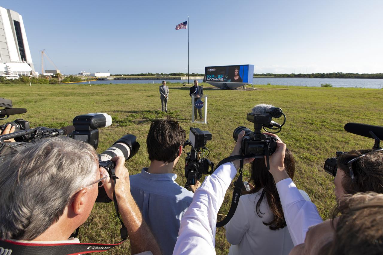 NASA Administrator Jim Bridenstine, at the podium, speaks to members of the news media at the NASA News Center on May 23, 2019. At left is Kennedy Space Center Director Bob Cabana. News media were at the center for an Apollo 11 Media Day. They toured several facilities, including the Vehicle Assembly and Launch Complex 39B for a look back at the Apollo missions and a look ahead to NASA’s new Moon 2024 initiative, the Artemis 1 mission and the Gateway lunar outpost.